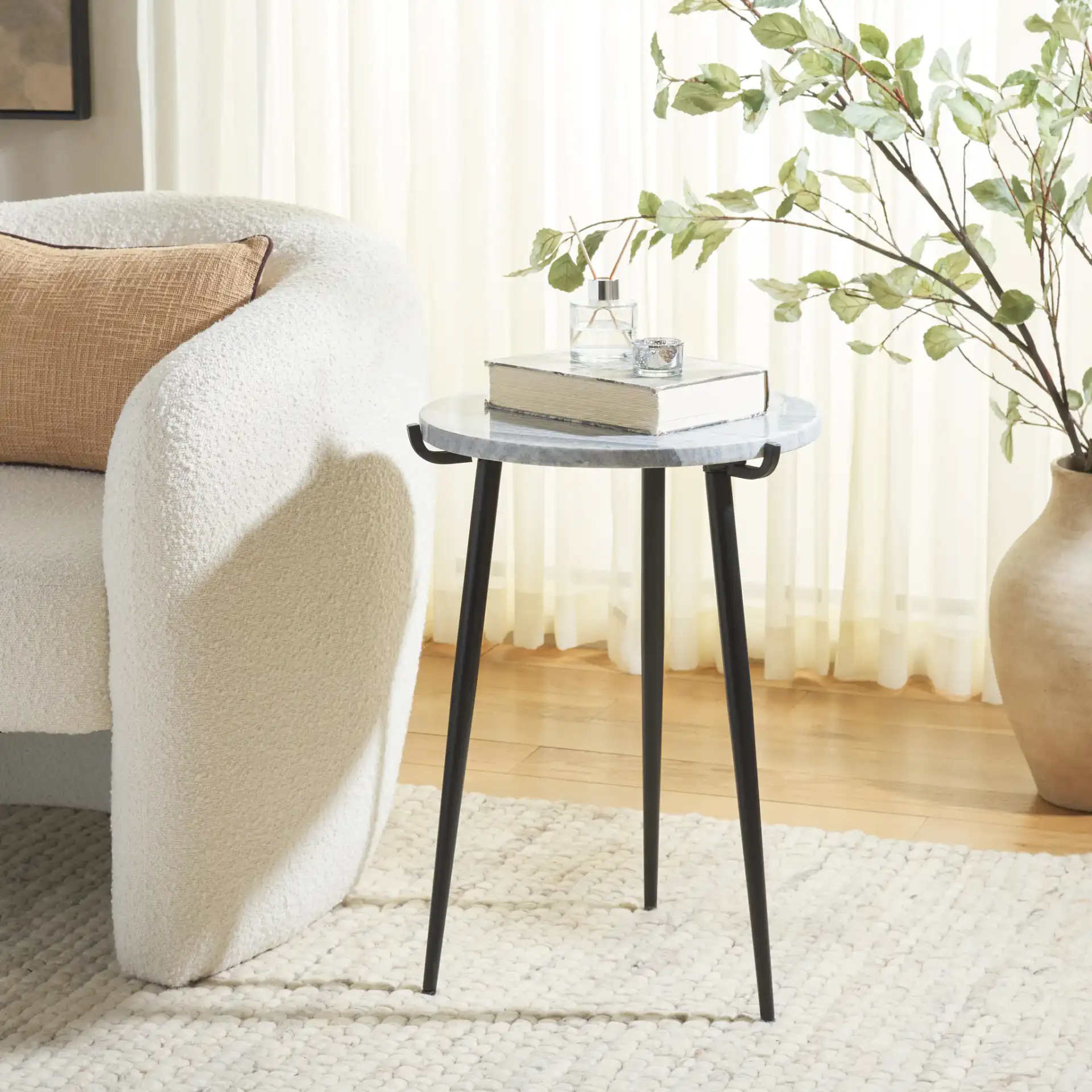 Hesse Marble Side Table in Gray / Black in a styled room