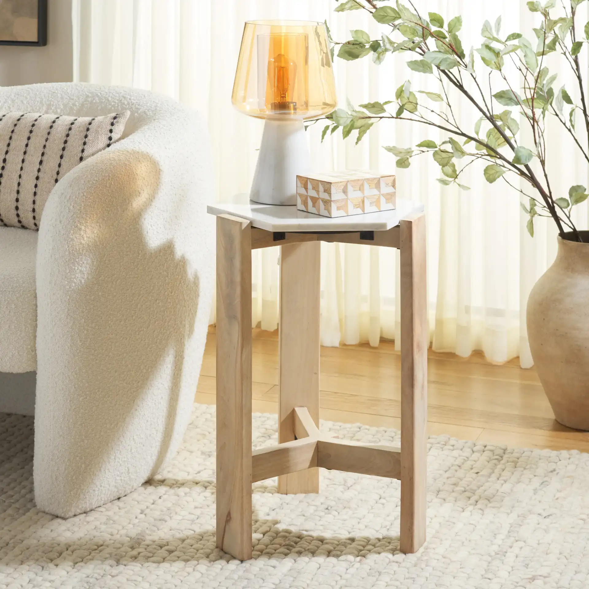 Pisa Marble Side Table in White / Natural in a styled room