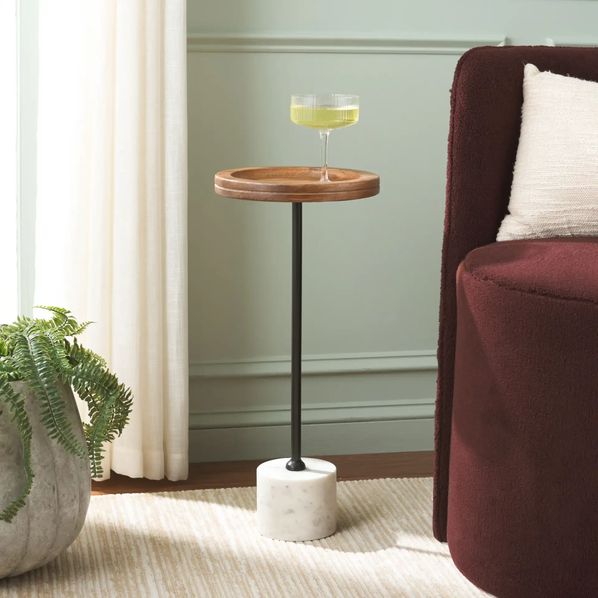 Elisabeth Round Side Table in Brown / Black in a styled room