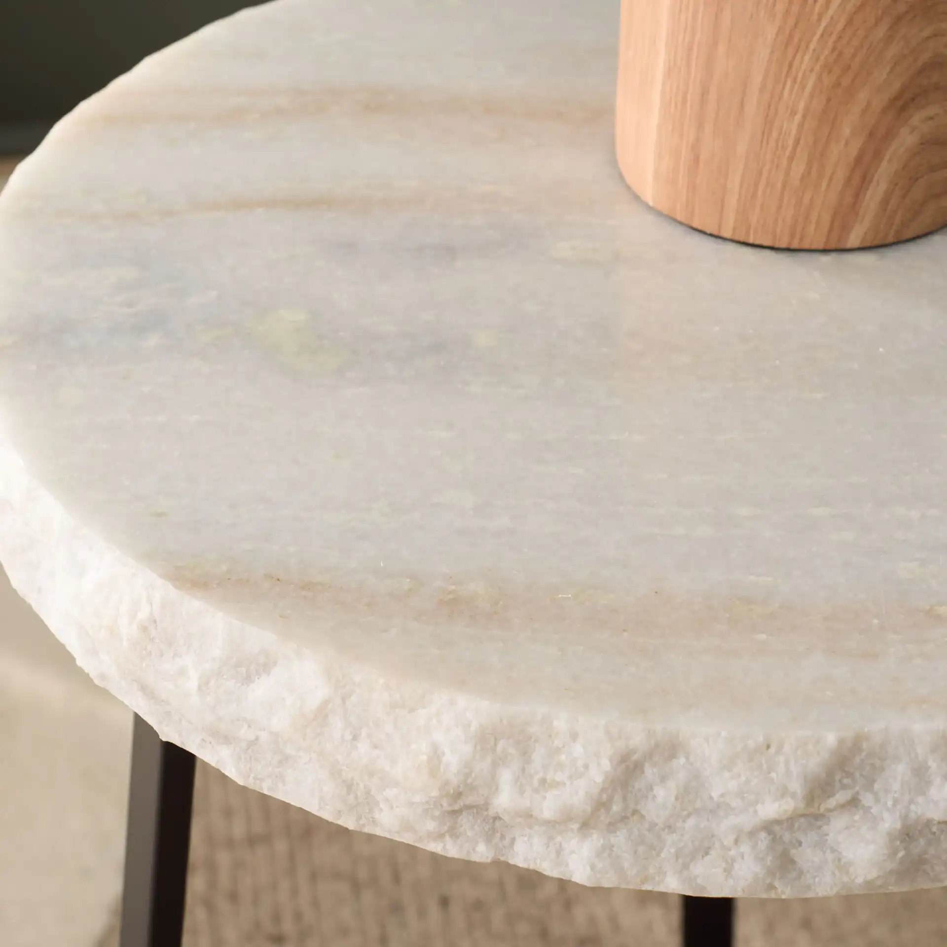Elenore Marble Side Table in Cream / Black in a styled room