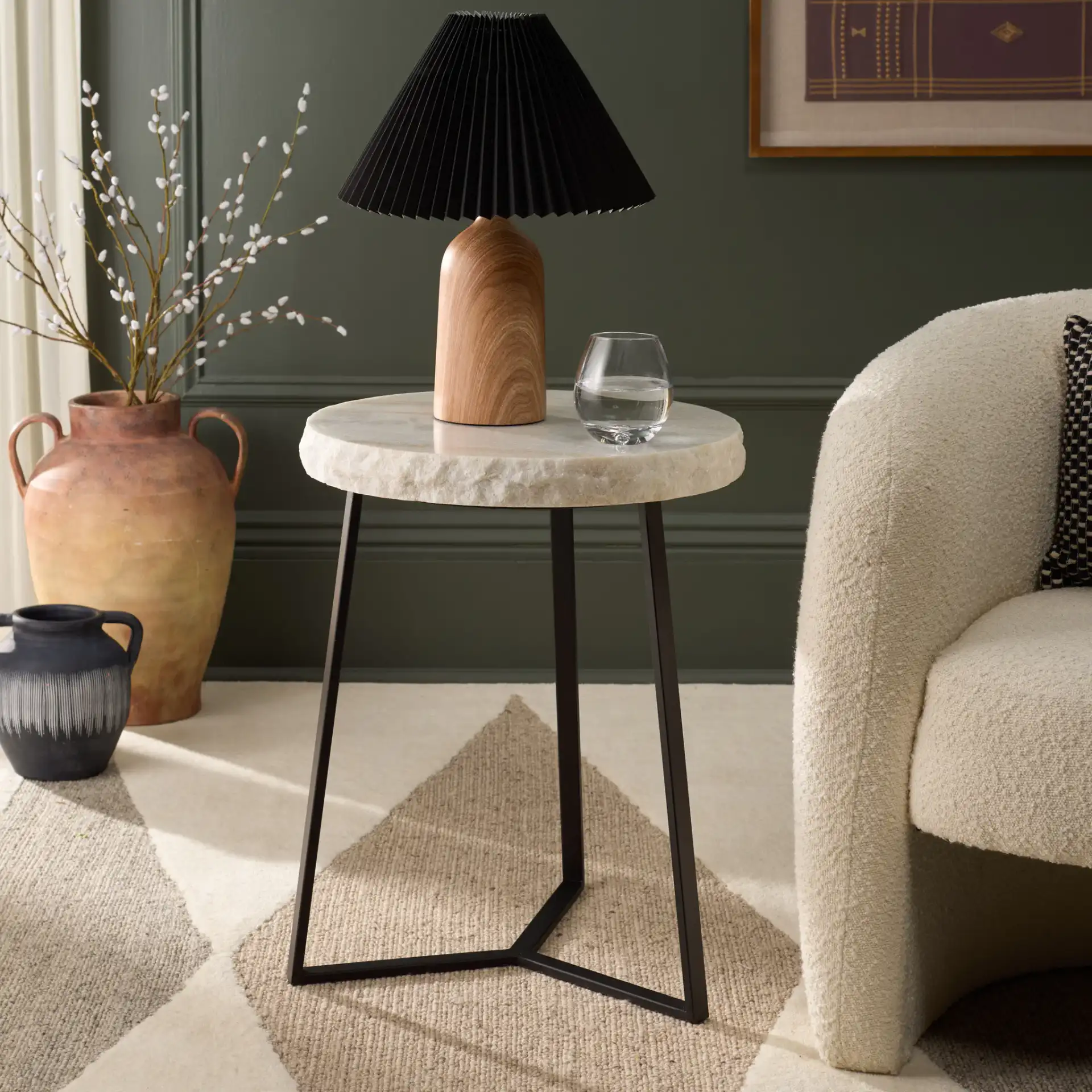 Elenore Marble Side Table in Cream / Black in a styled room