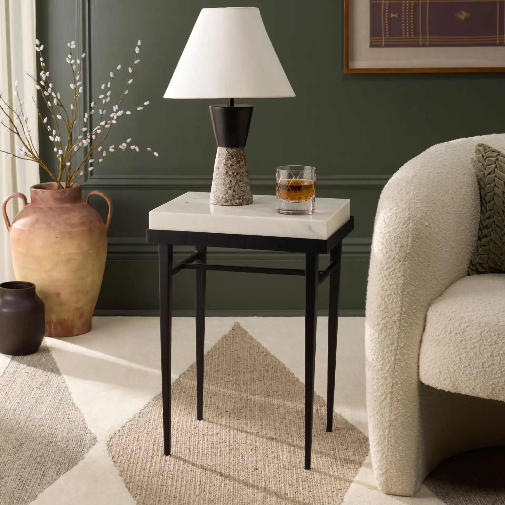 Eldin Marble Side Table in Cream / Black in a styled room