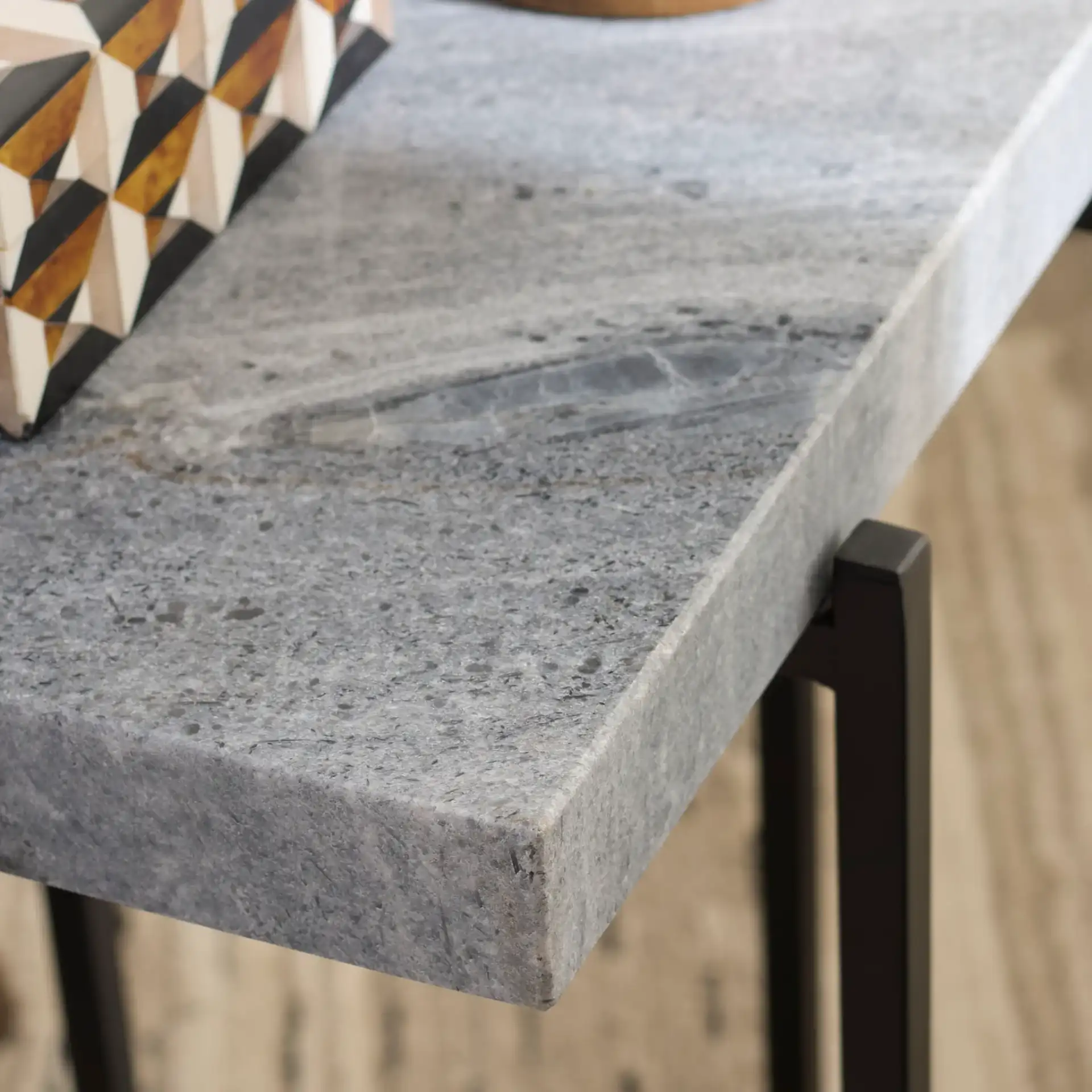 Aloha Marble Side Table in Gray / Black in a styled room