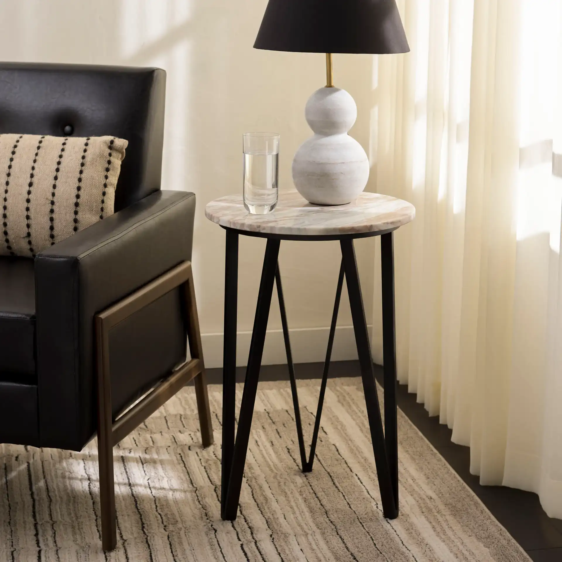 Reni Marble Side Table in Brown / Black in a styled room