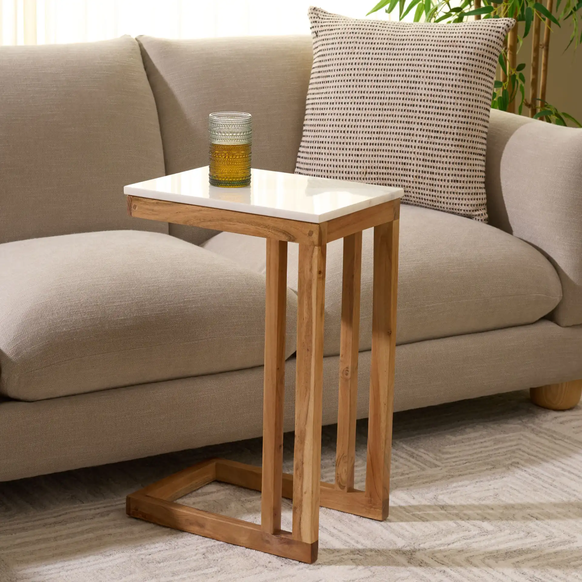 Zinaida Marble Accent Table in White / Natural in a styled room