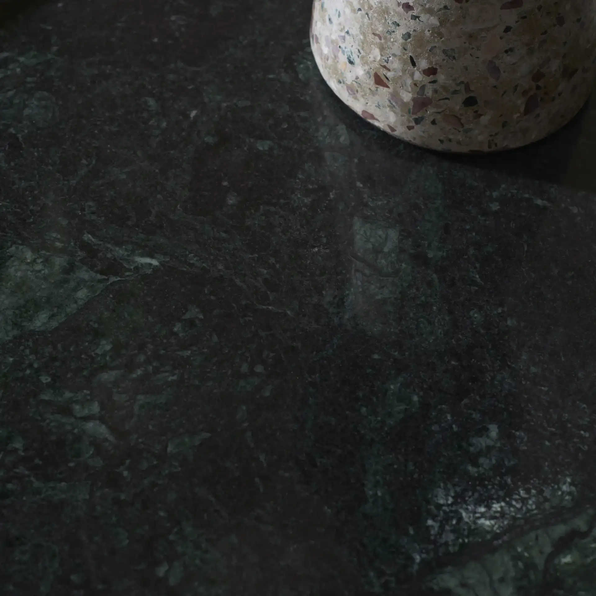 Cari Marble Top Accent Table in Black / Green in a styled room