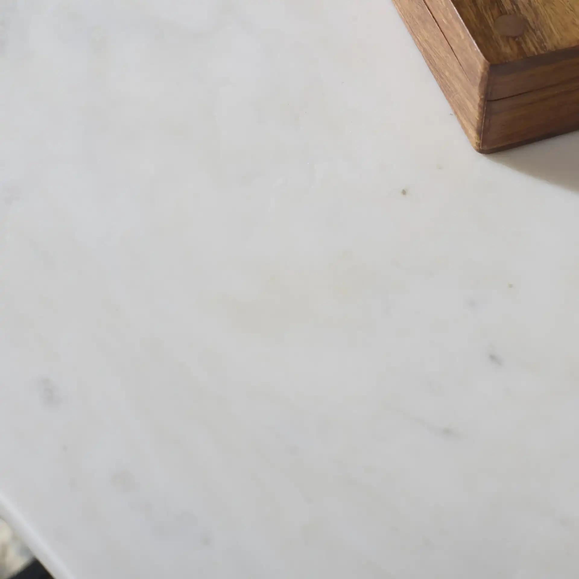 Rizo Top Accent Table in Black / White in a styled room