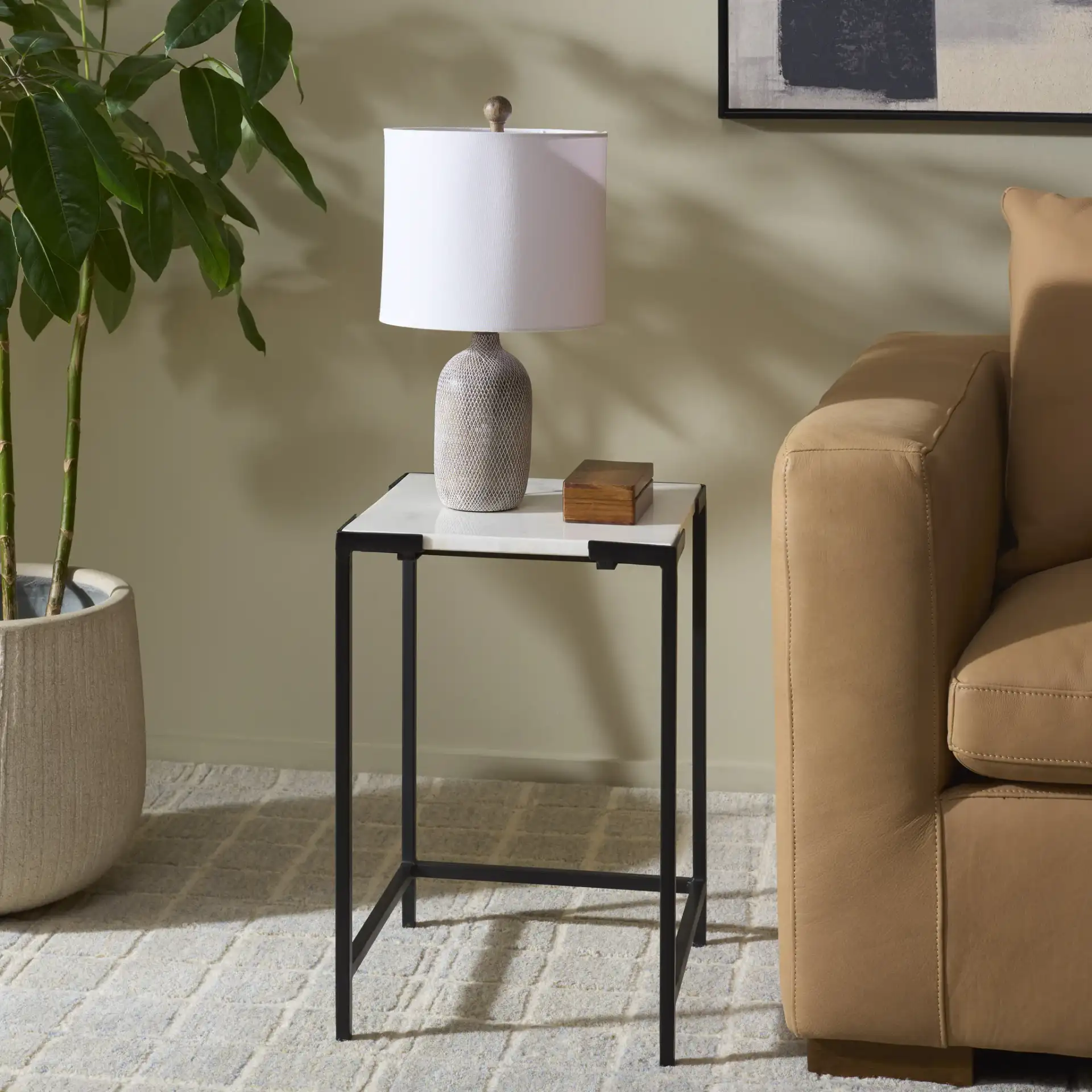Rizo Top Accent Table in Black / White in a styled room