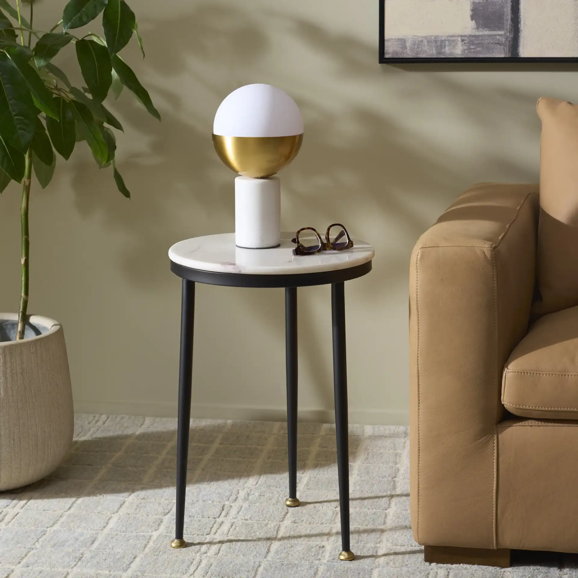 Katya Accent Table in Black / White in a styled room