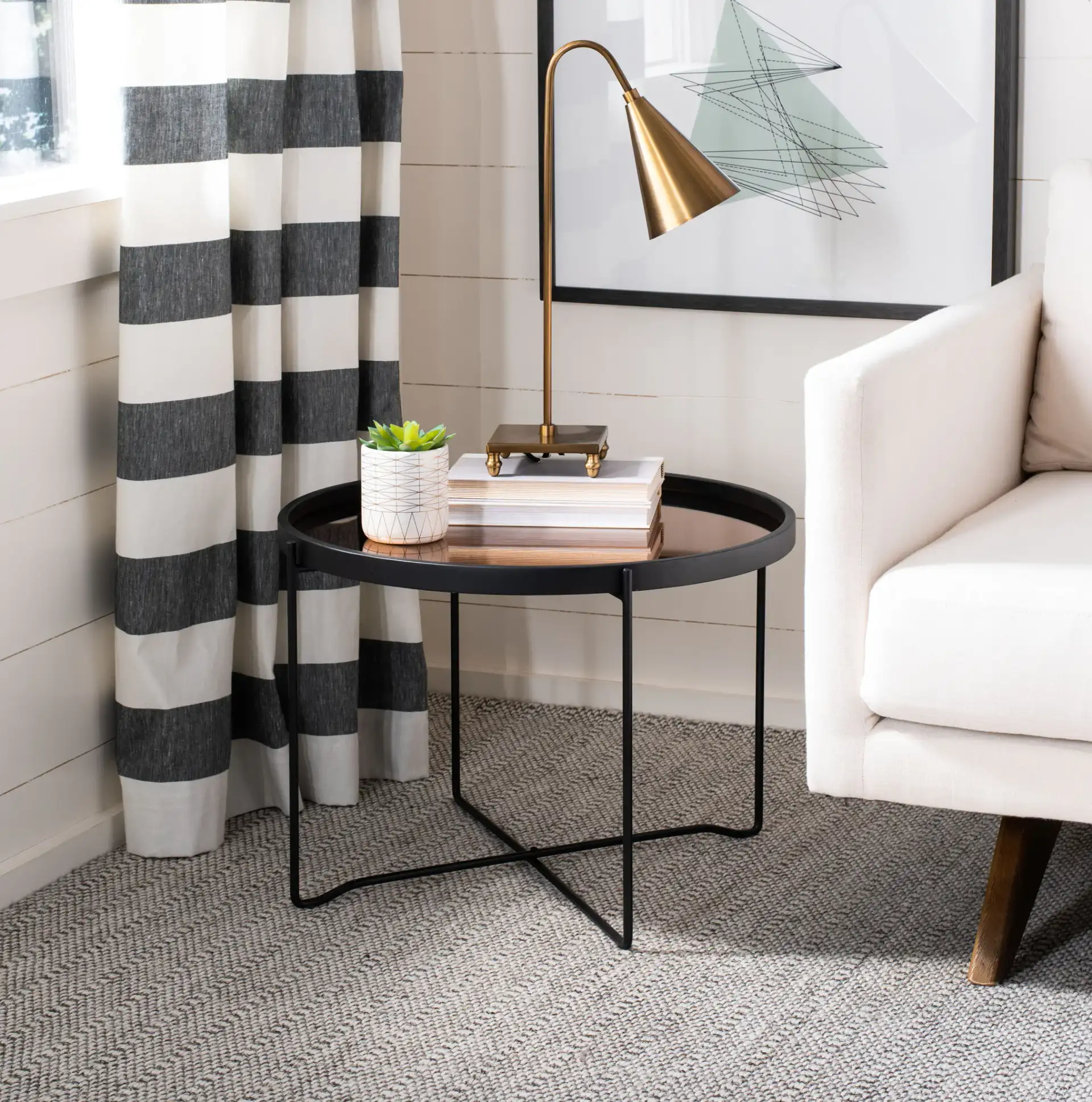 Ruby Medium Tray Accent Table in Rose Gold / Black in a styled room