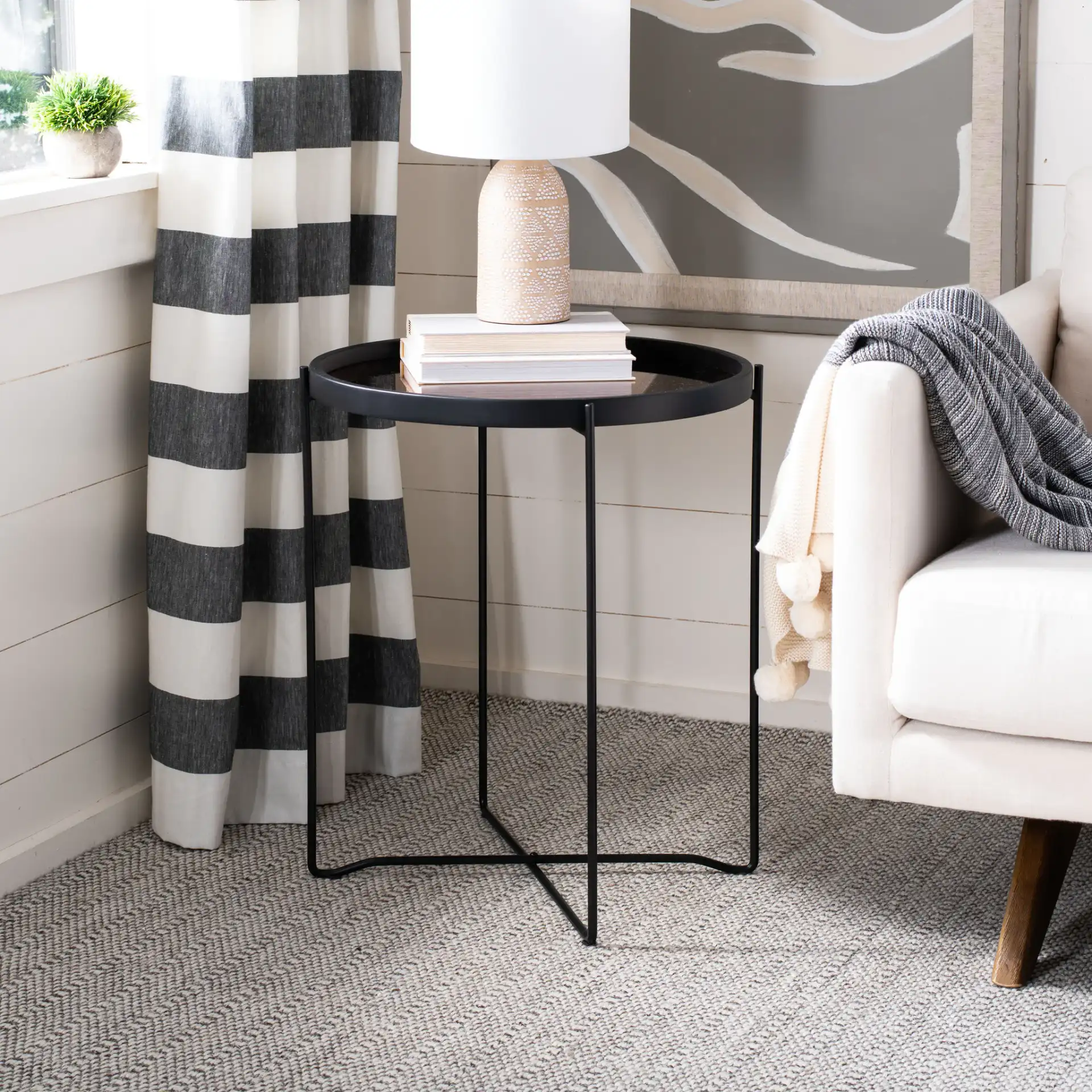 Ruby Small Tray Accent Table in Rose Gold / Black in a styled room