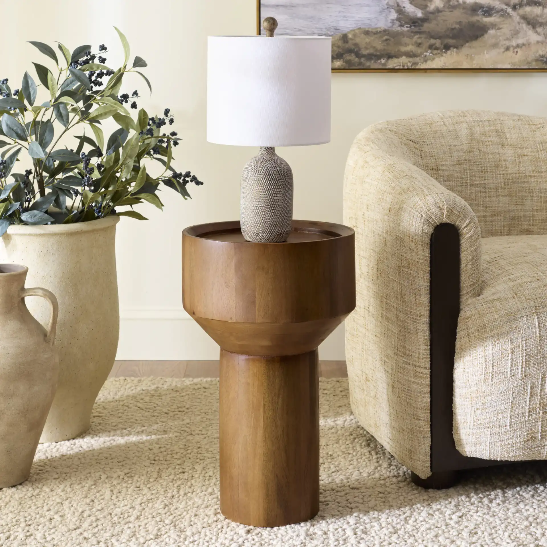 Yaroslav Round Accent Table in Light Honey in a styled room