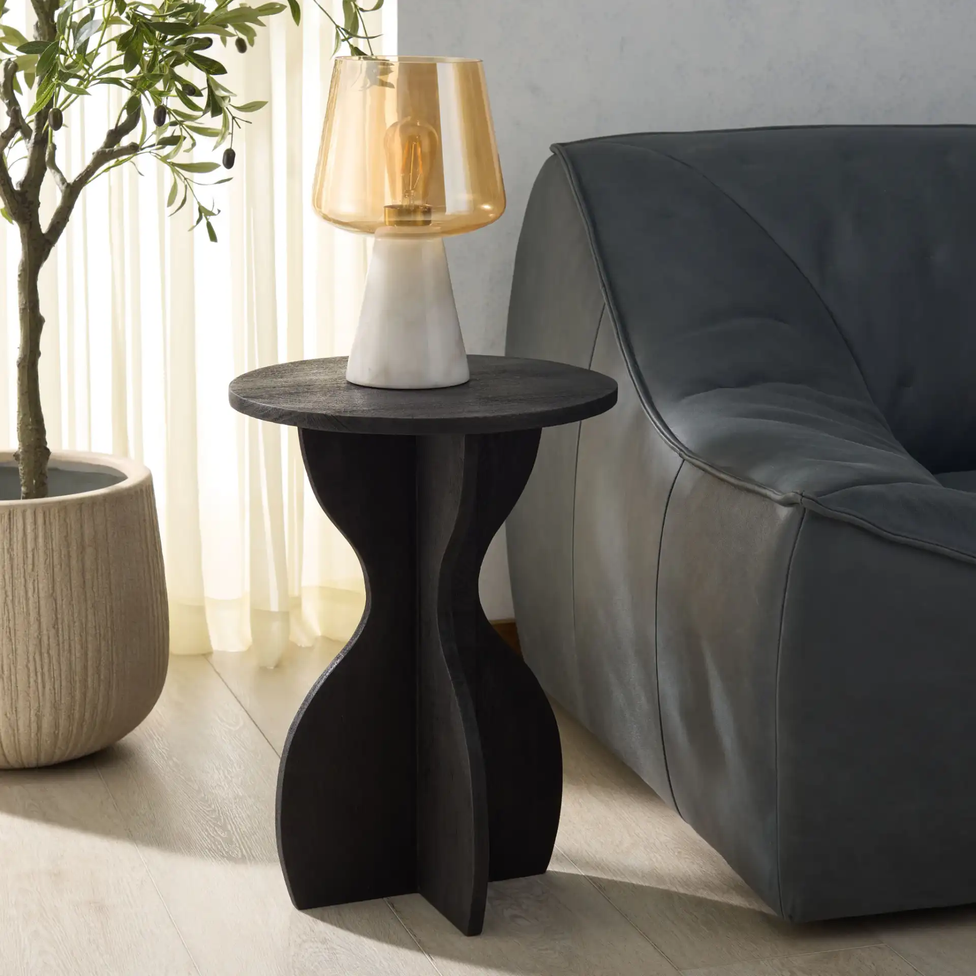 Eldwin Accent Table in Black in a styled room