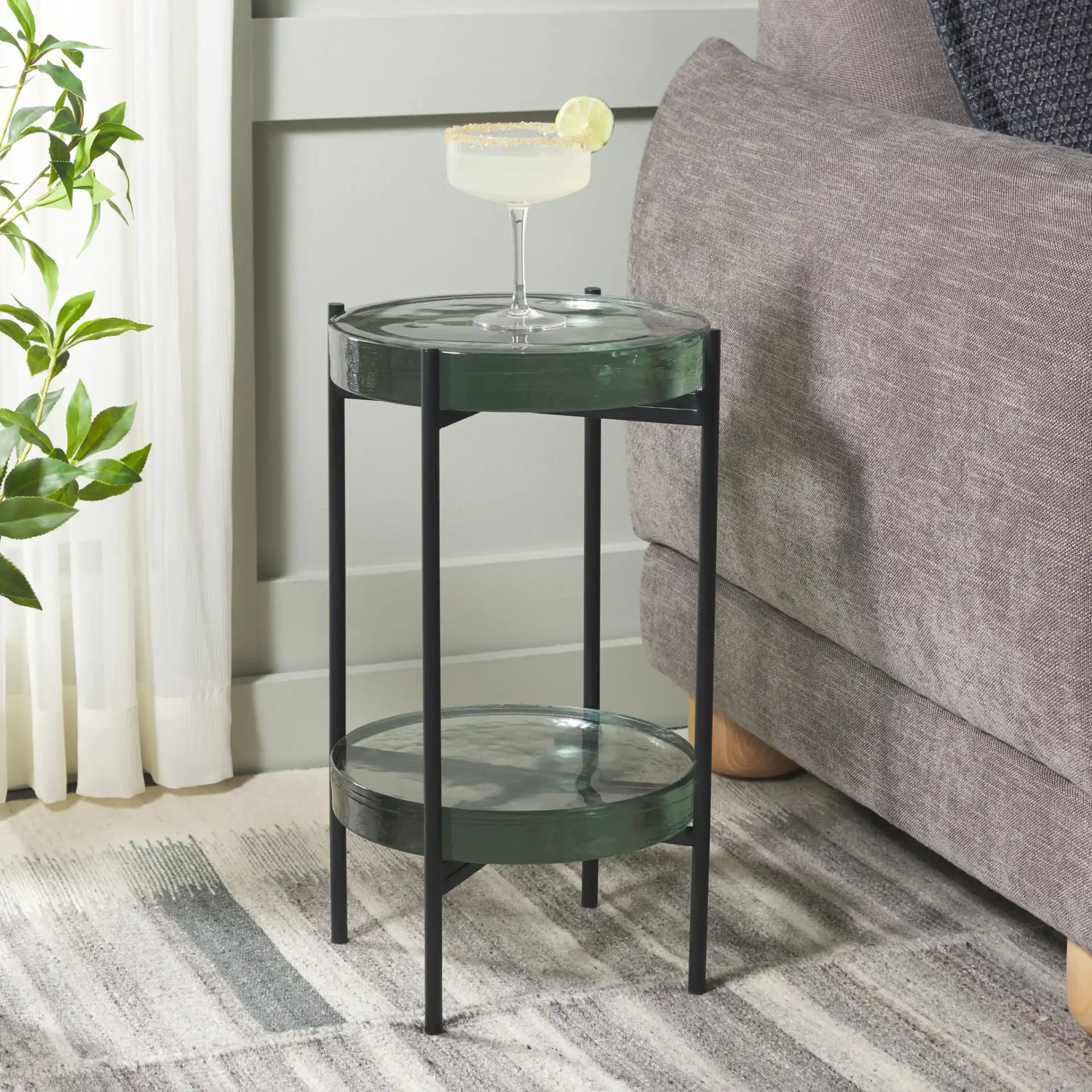 Noham Side Table in Clear / Black in a styled room