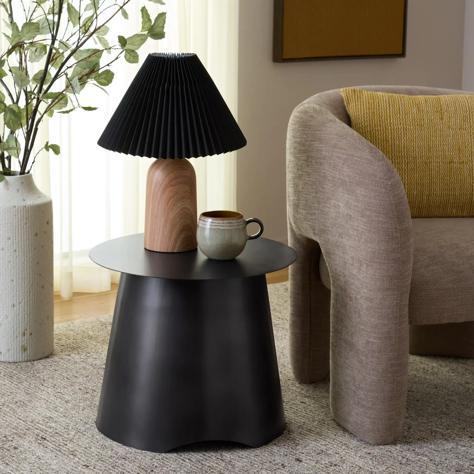 Aminchy Side Table in Antique Black in a styled room