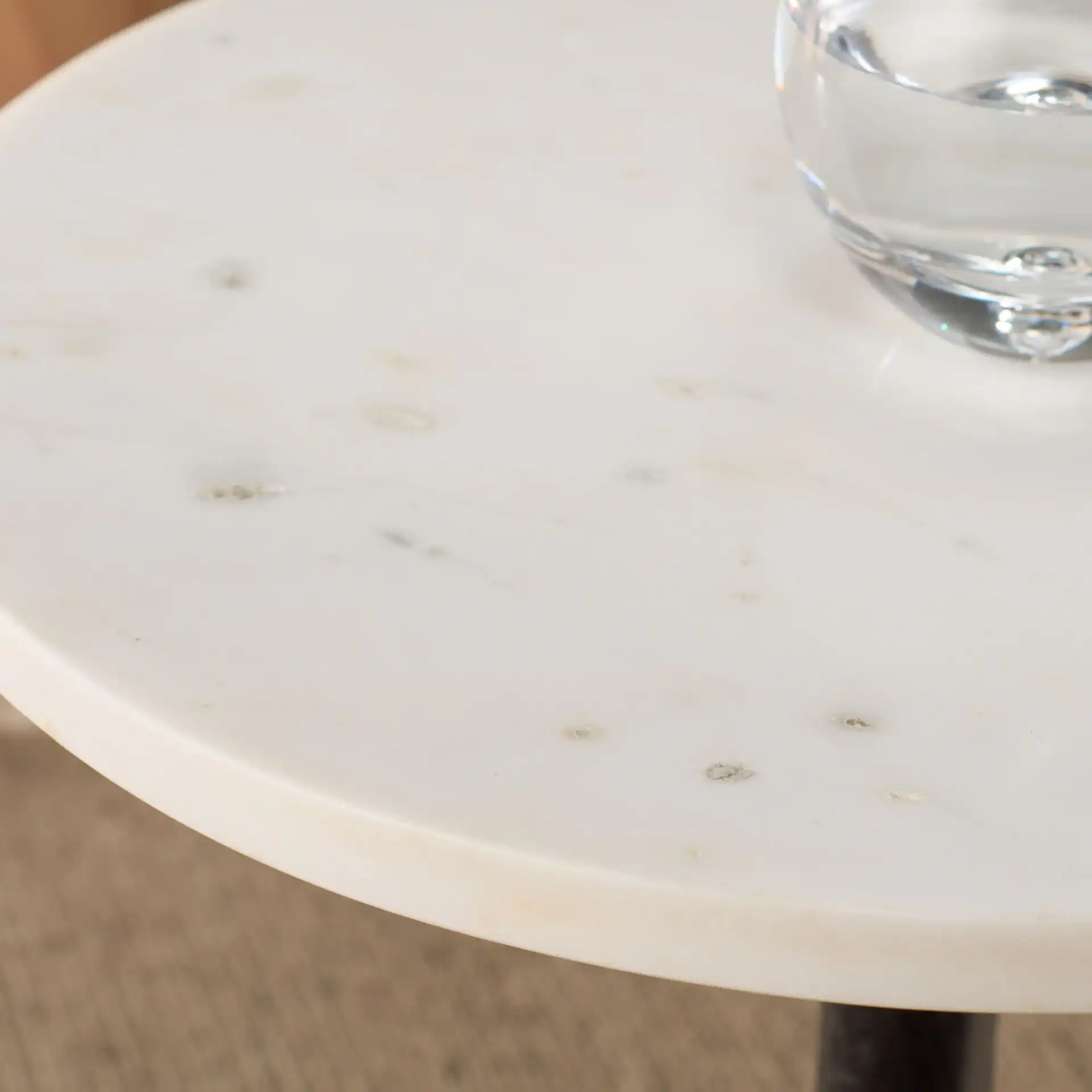 Avanni Side Table in Black / Ivory in a styled room