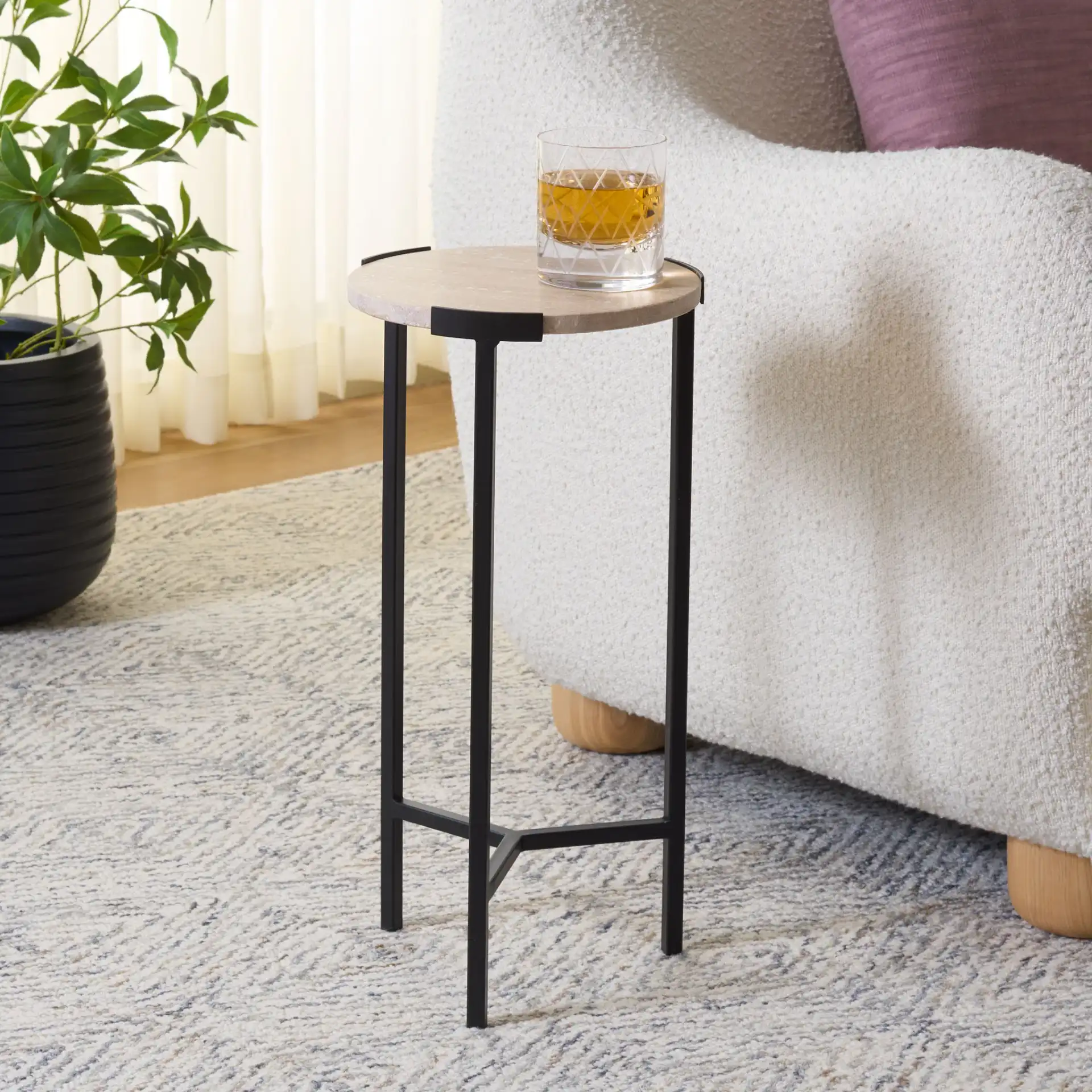 Abama Marble Side Table in Ivory / Black in a styled room