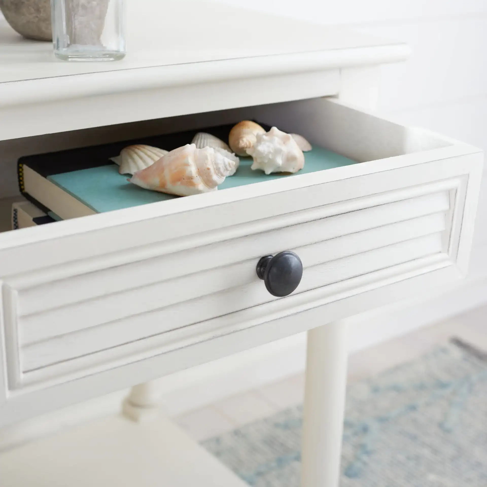 Tate One-Drawer Accent Table in Distressed White in a styled room