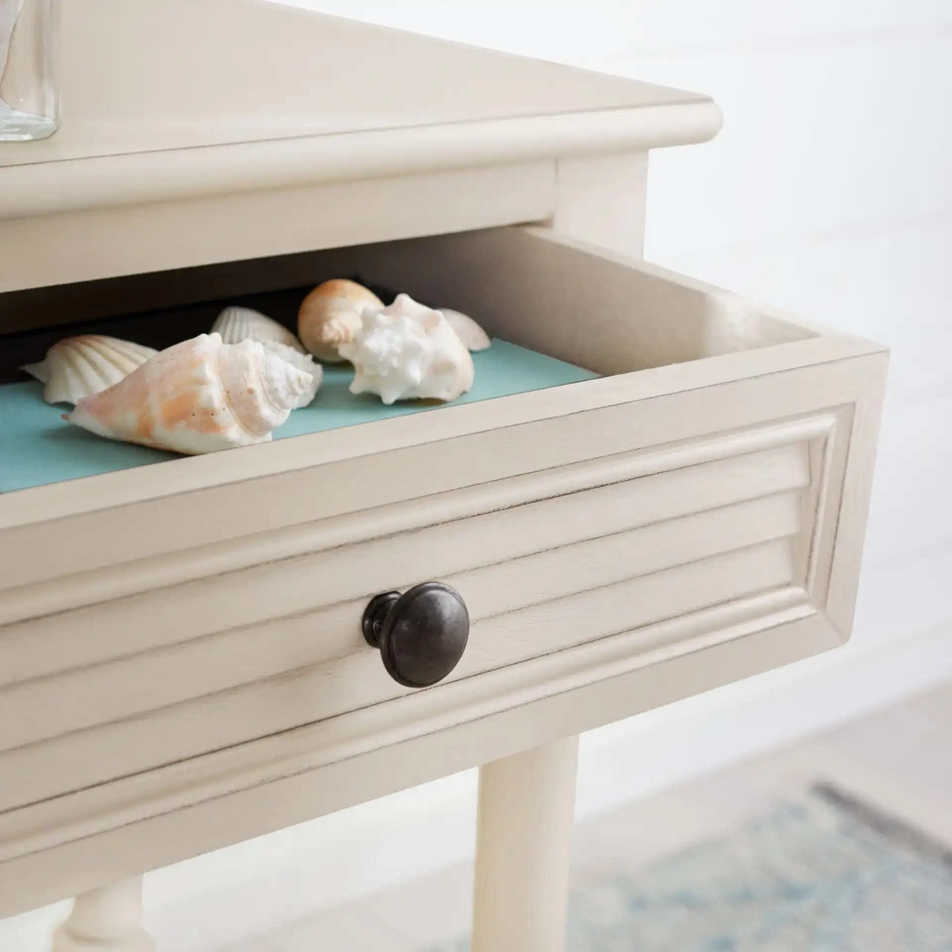 Tate One-Drawer Accent Table in Distressed White in a styled room