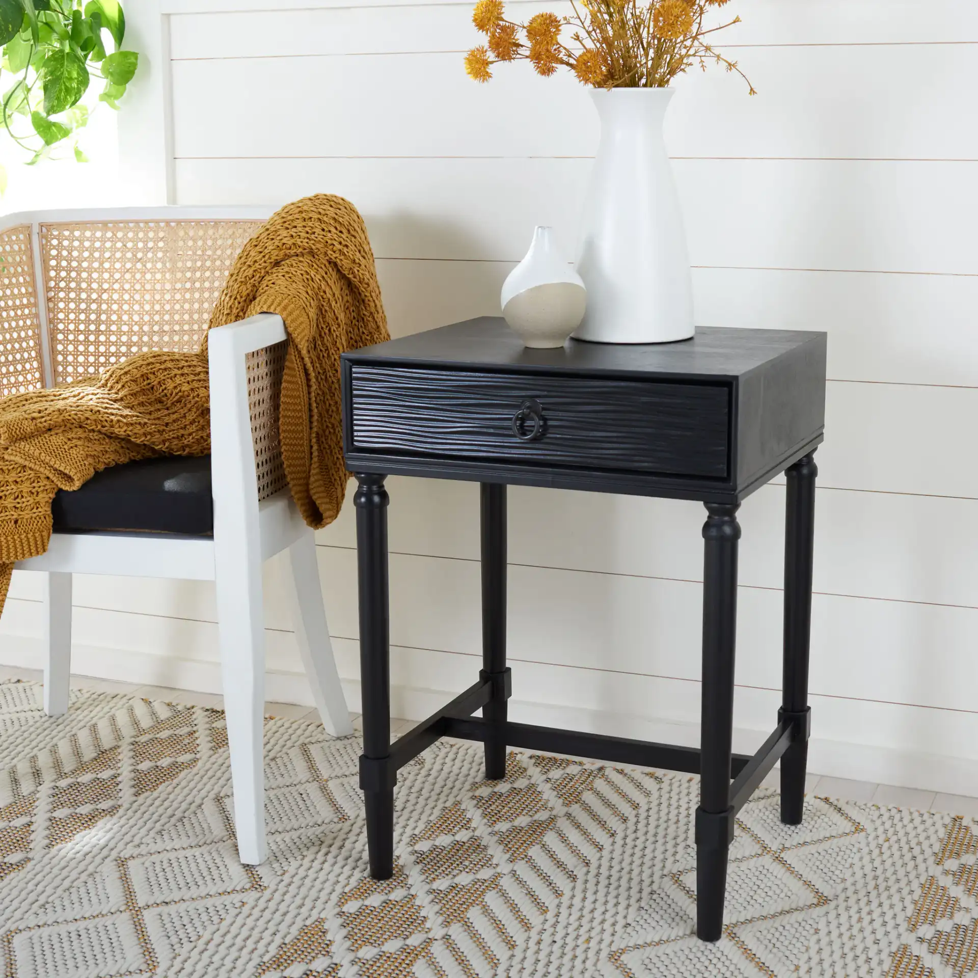 Mabel One-Drawer Accent Table in Black in a styled room