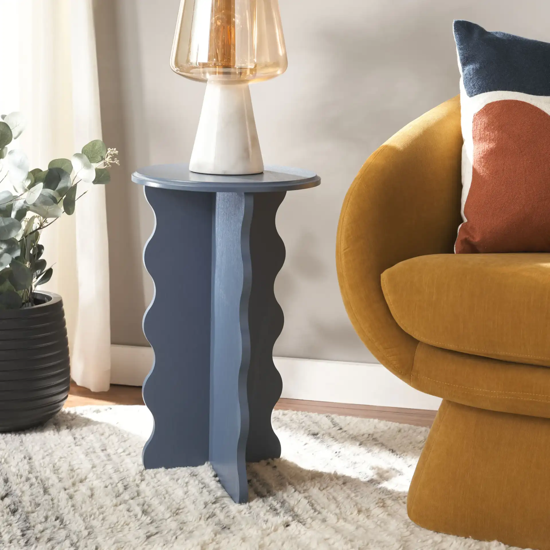 Lilith Wavy Accent Table in Blue in a styled room