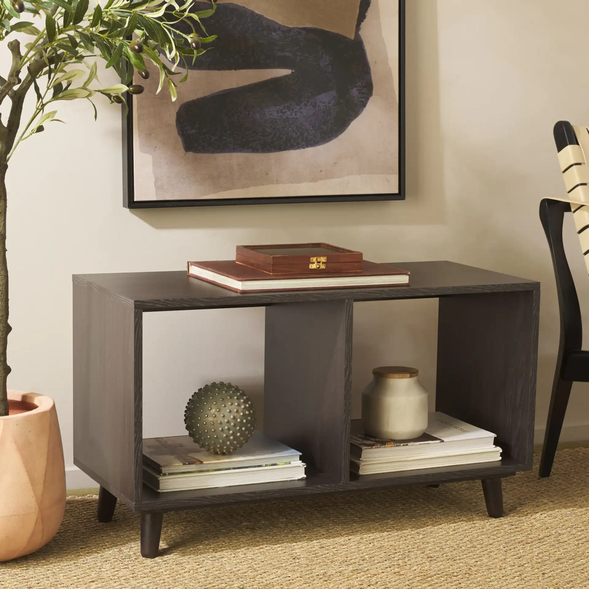 Yona Horizontal Accent Table in Black in a styled room