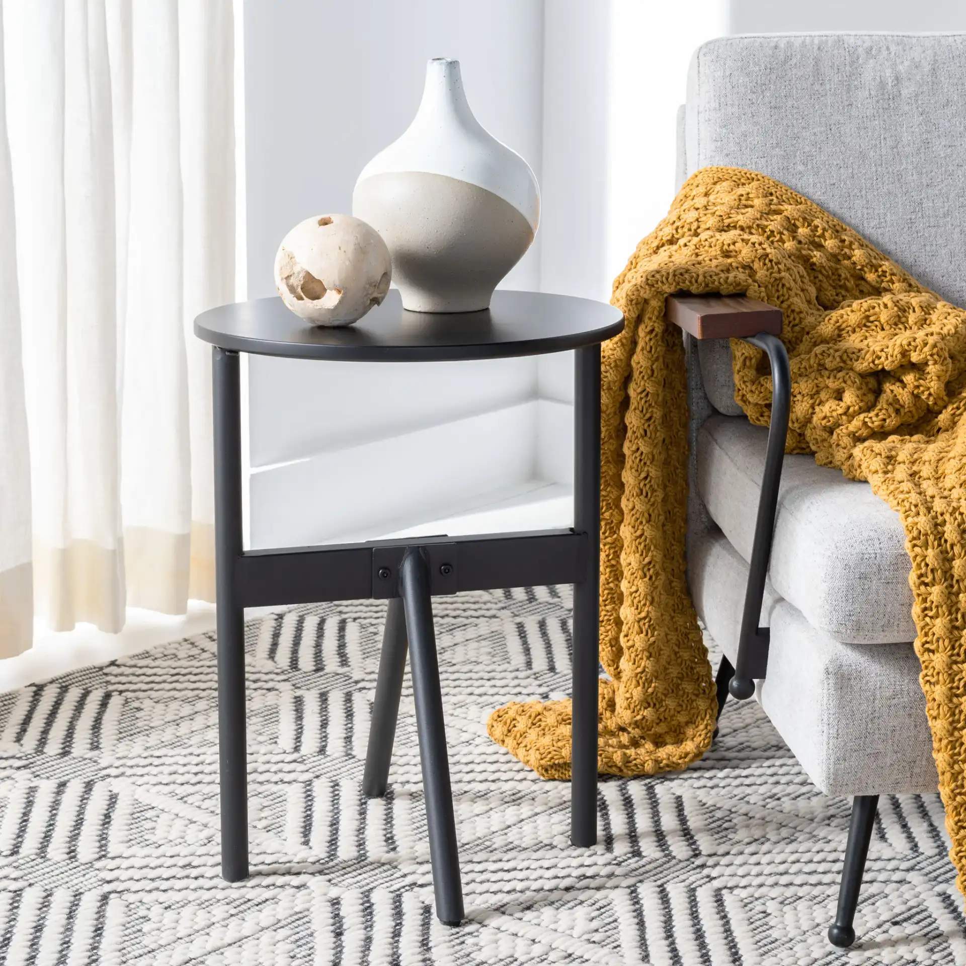 Gio Accent Table in Black in a styled room