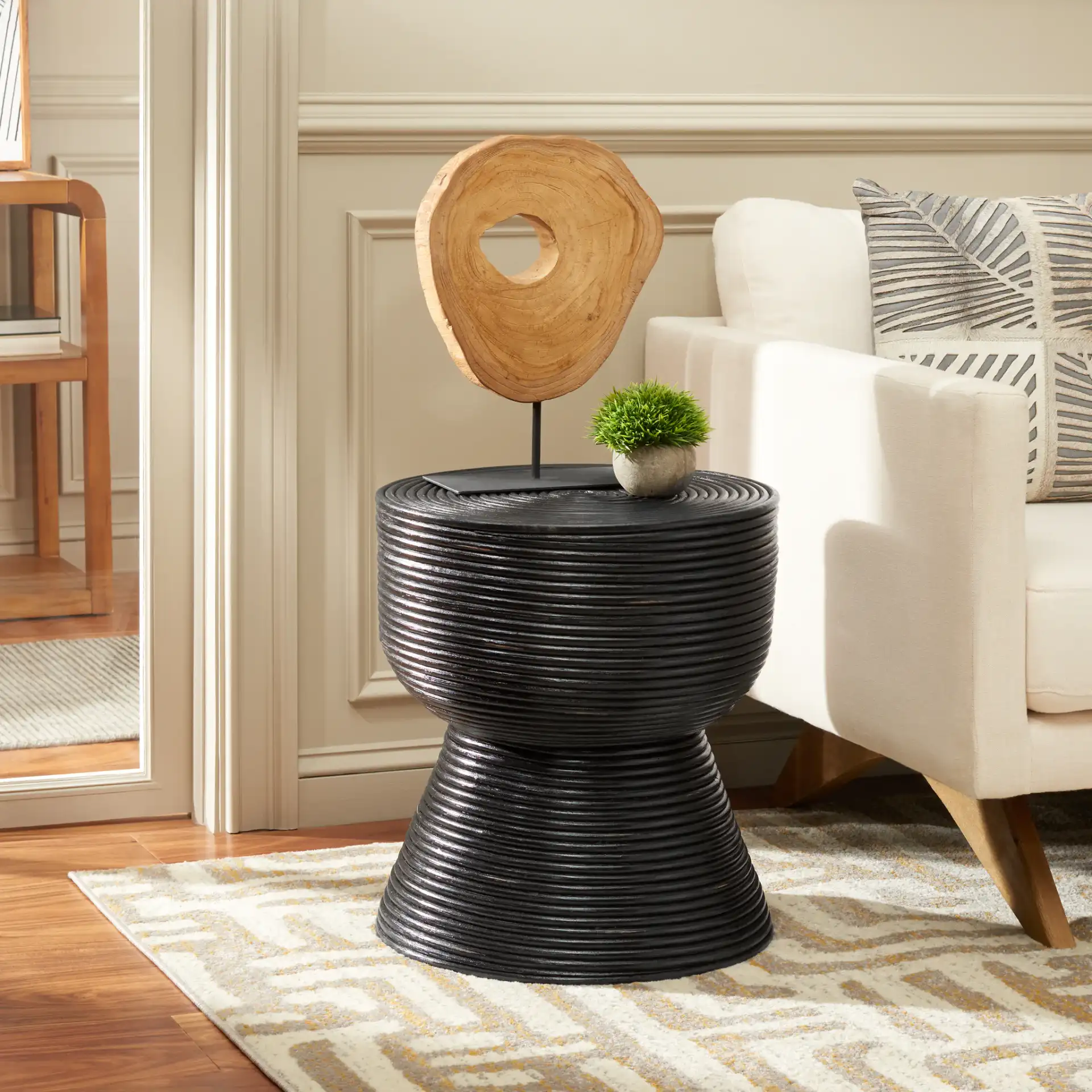 Heimdall Round Accent Table in Distressed Black / Black in a styled room