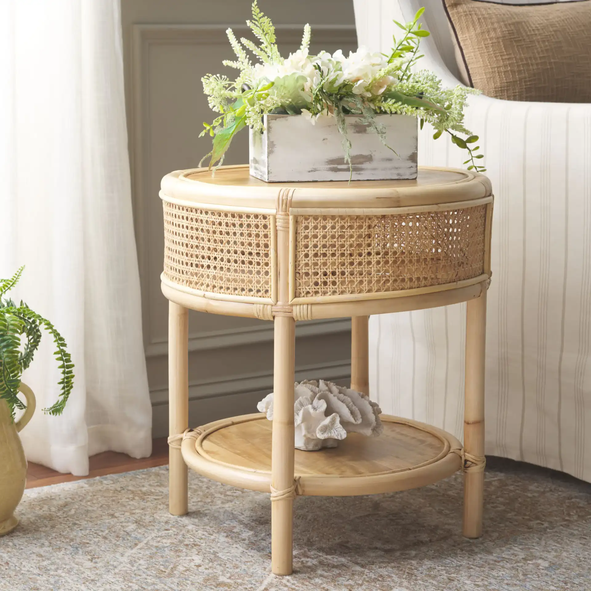 Arvid Round Accent Table in Natural in a styled room