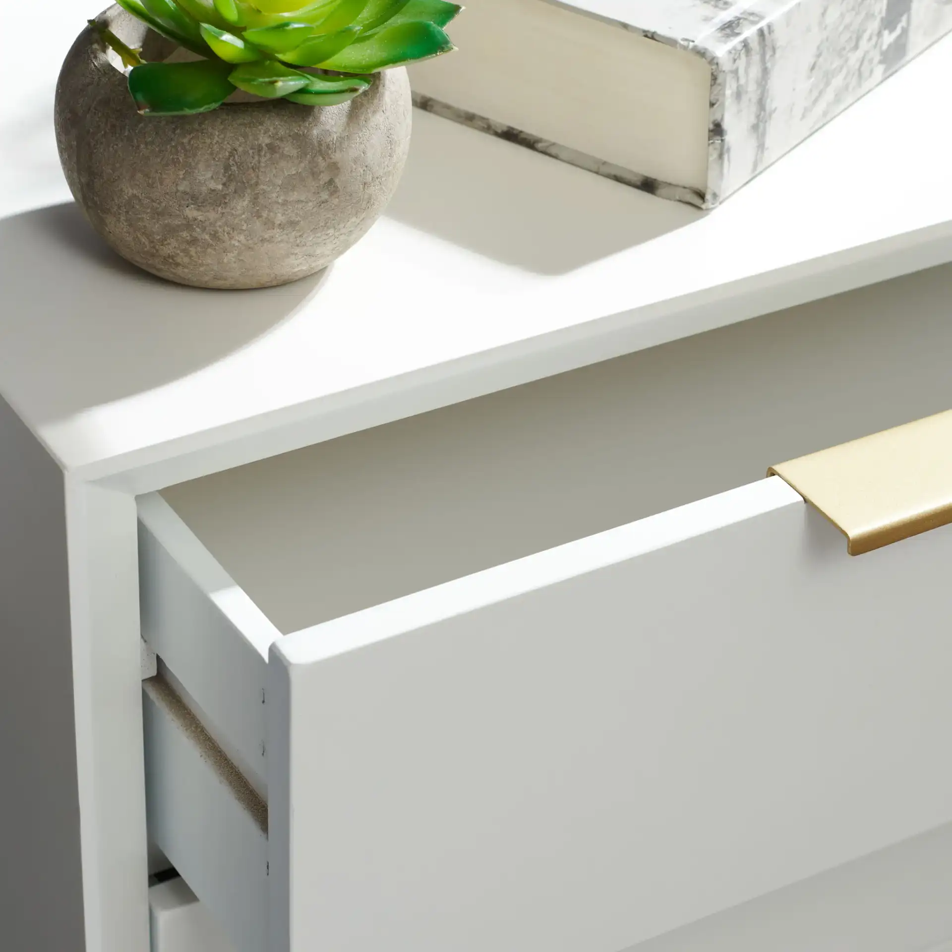 Baskin Three-Drawer Accent Table in White in a styled room