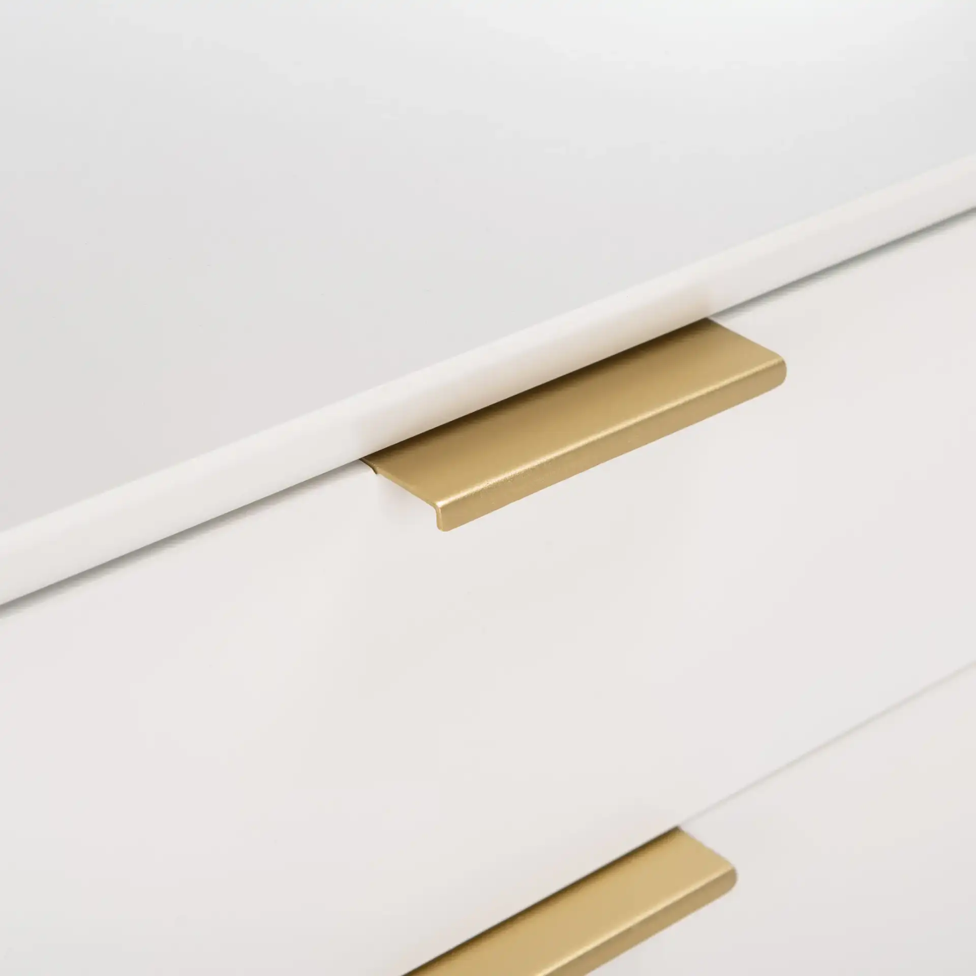 Baskin Three-Drawer Accent Table in White in a styled room