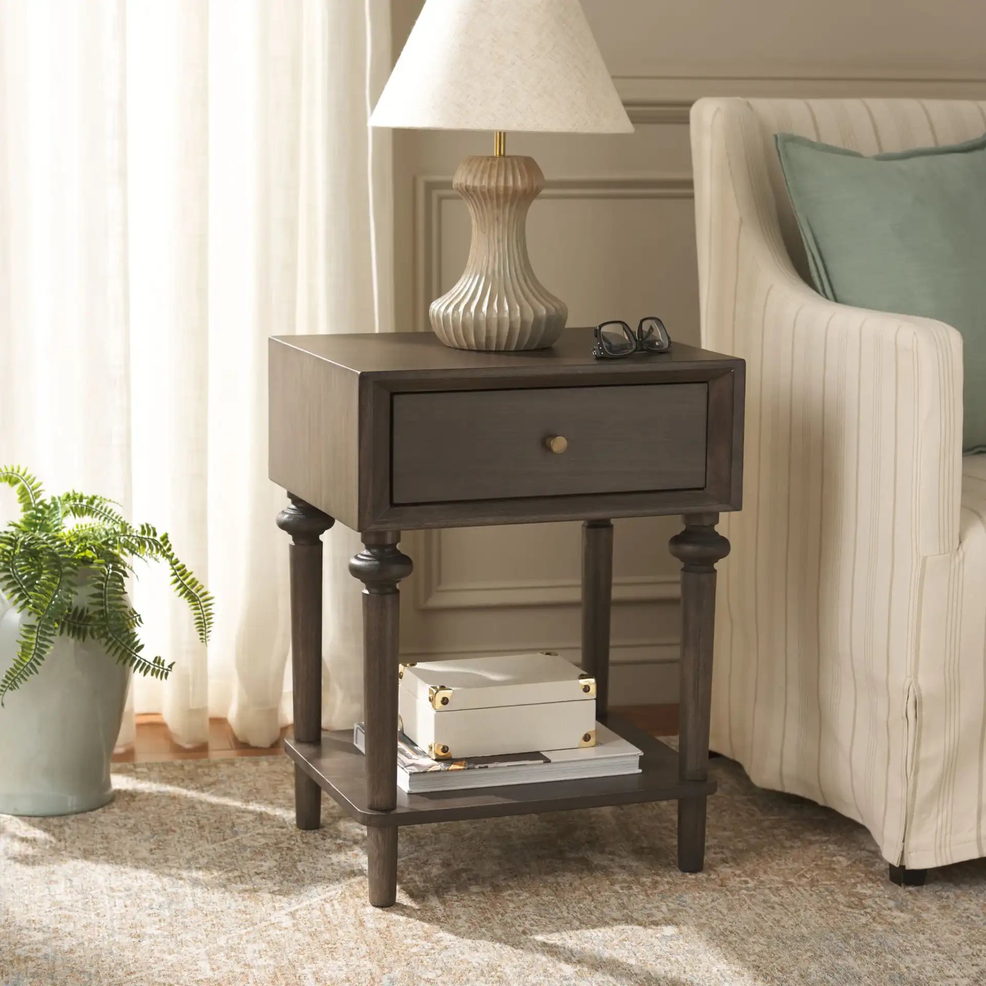 Ambrashi End Table in Dark Gray in a styled room