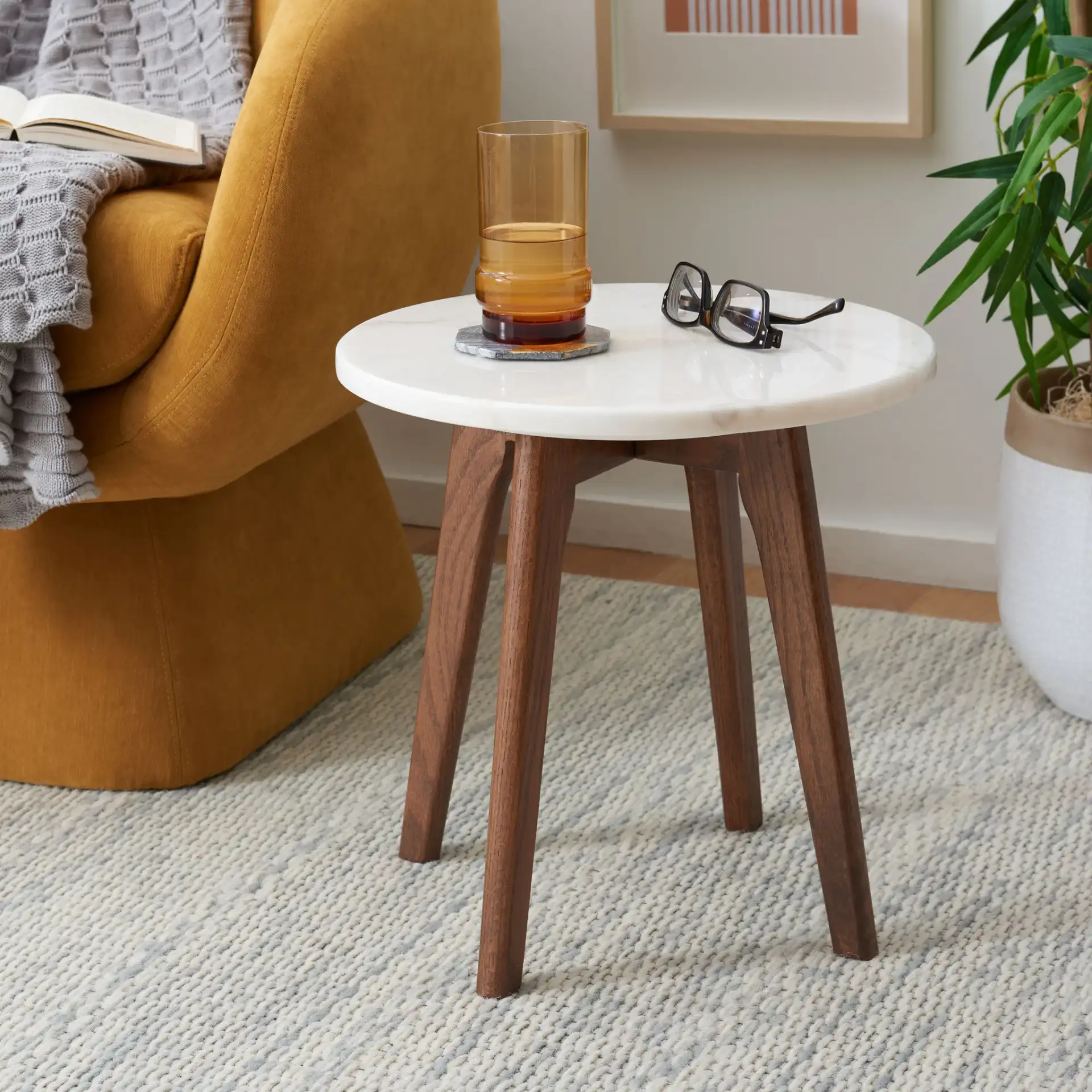 Marini Round Marble End Table in Marble / Walnut in a styled room