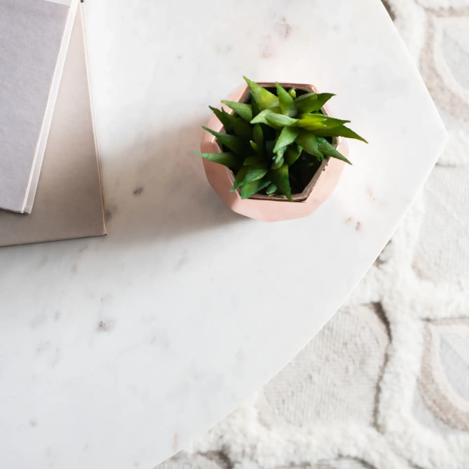Lara Marble Side Table in White Washed / White in a styled room