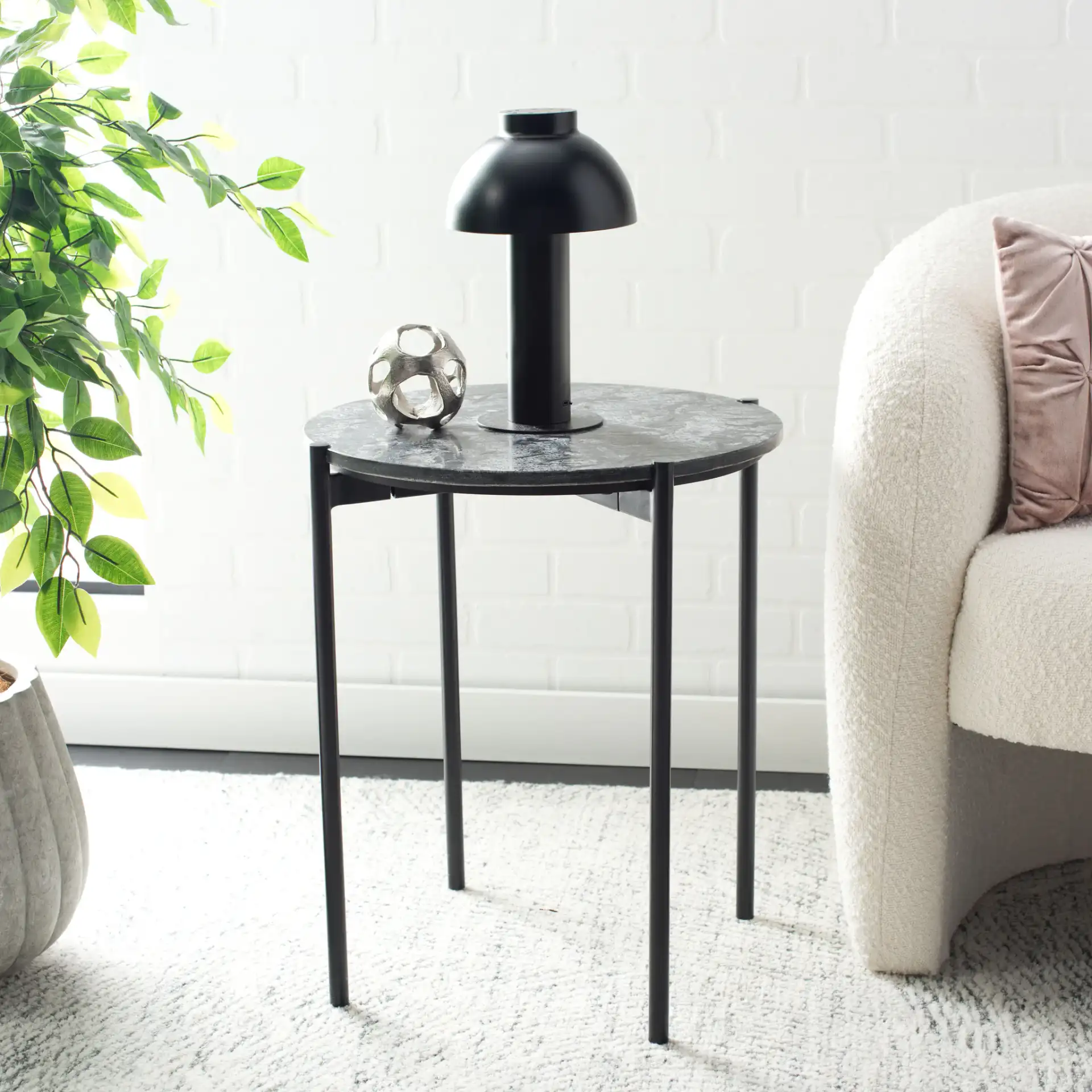 Pratt Round Side Table in Black in a styled room