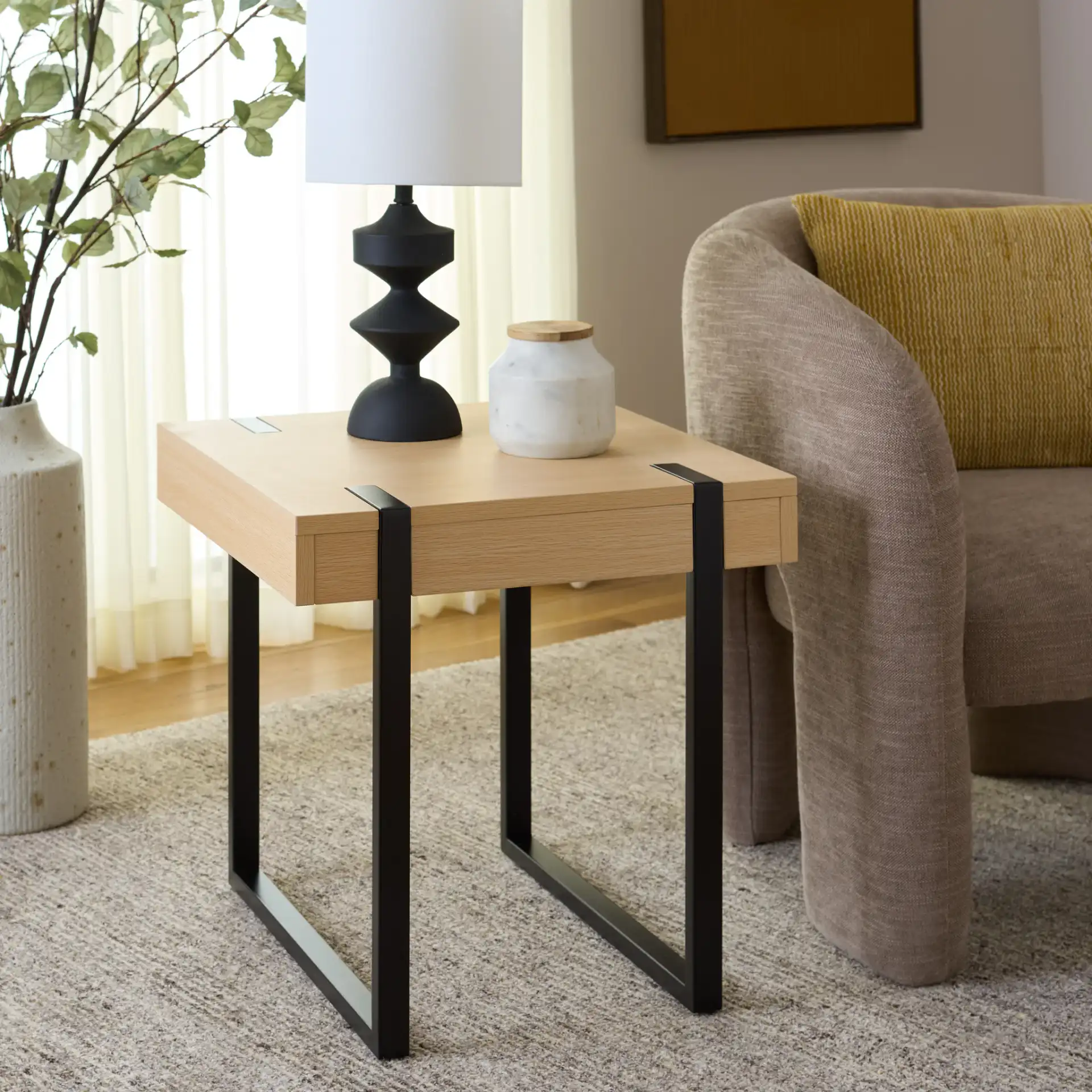 Klausner Accent Table in Sand / Black in a styled room
