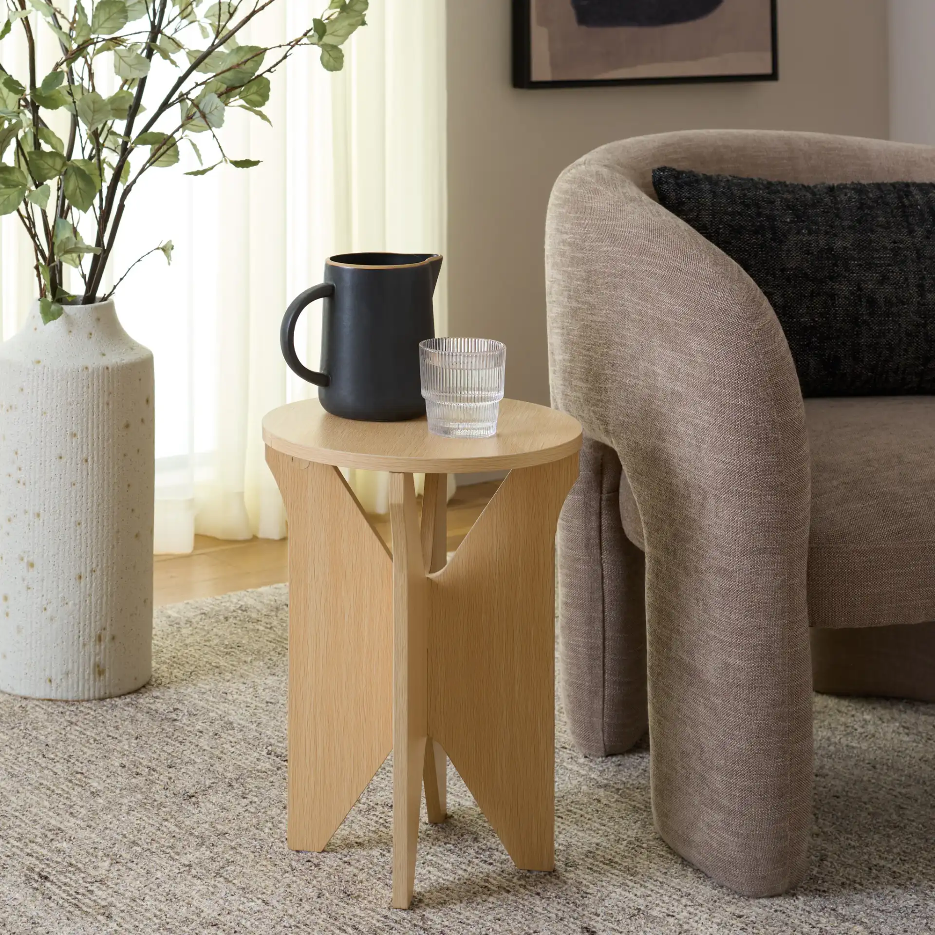 Elken Accent Table in Sand in a styled room