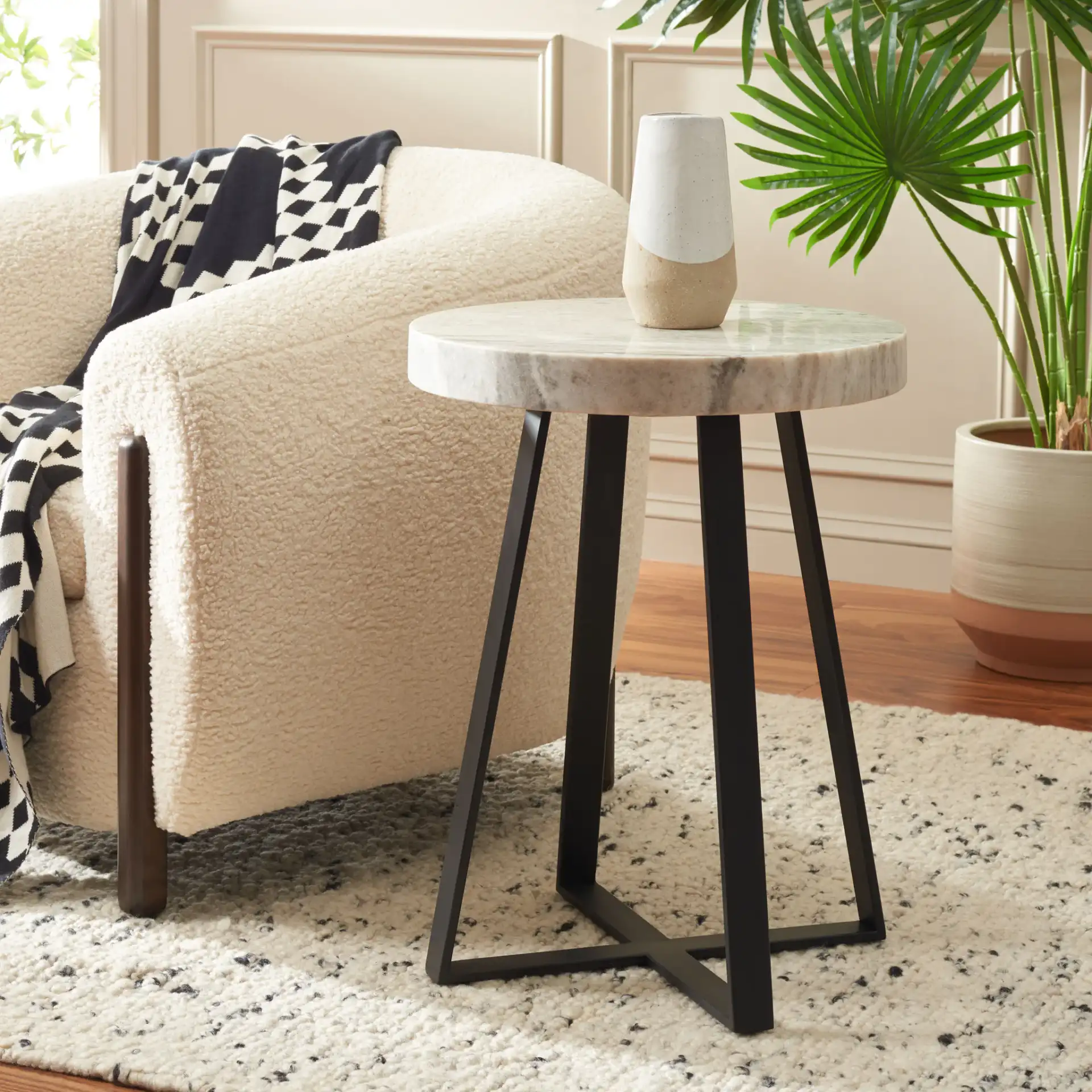 Guenon Round Accent Table in Gray Marble / Black in a styled room