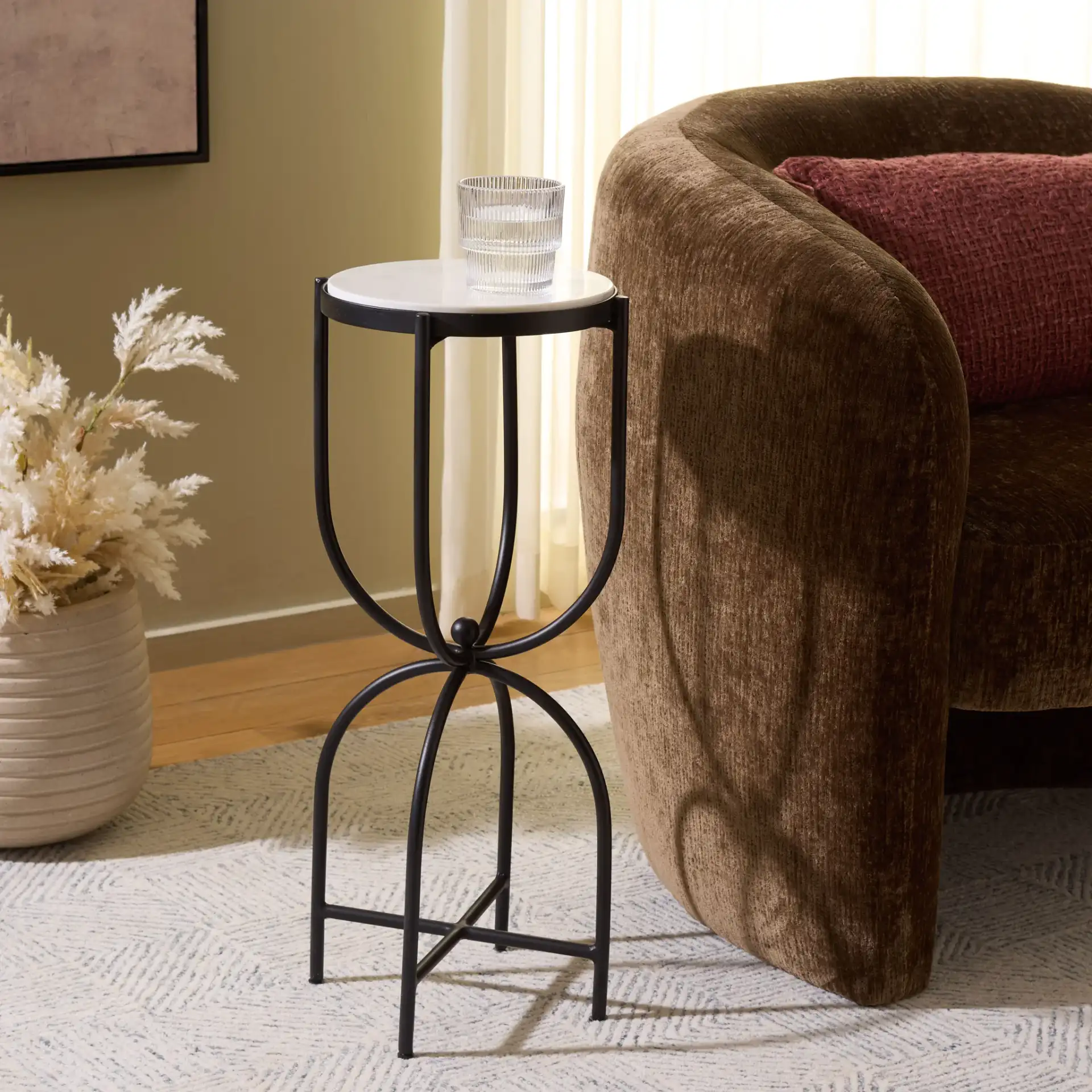 Daveth Round Drink Accent Table in White Marble / Black in a styled room