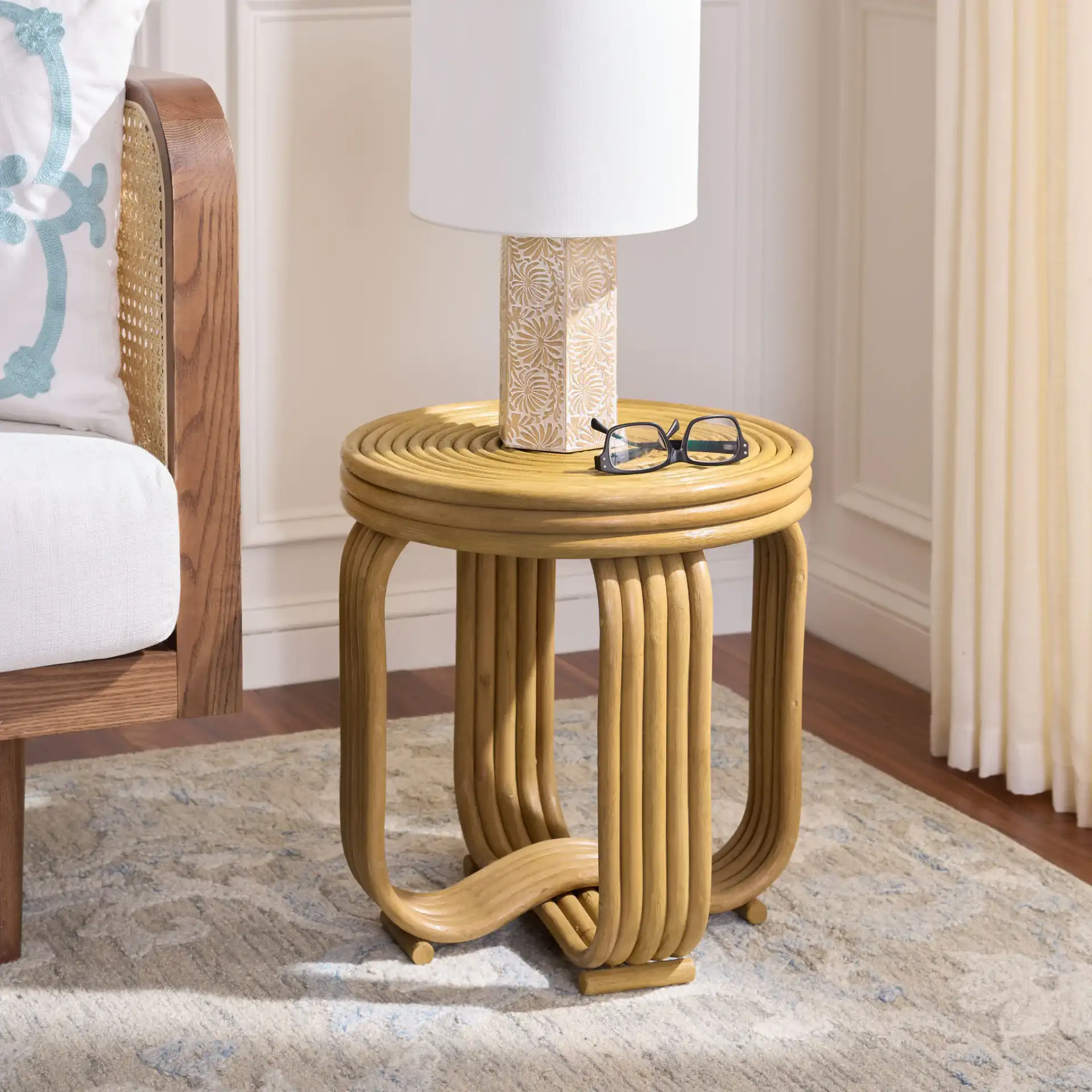 Asleesh Round Accent Table in Natural in a styled room