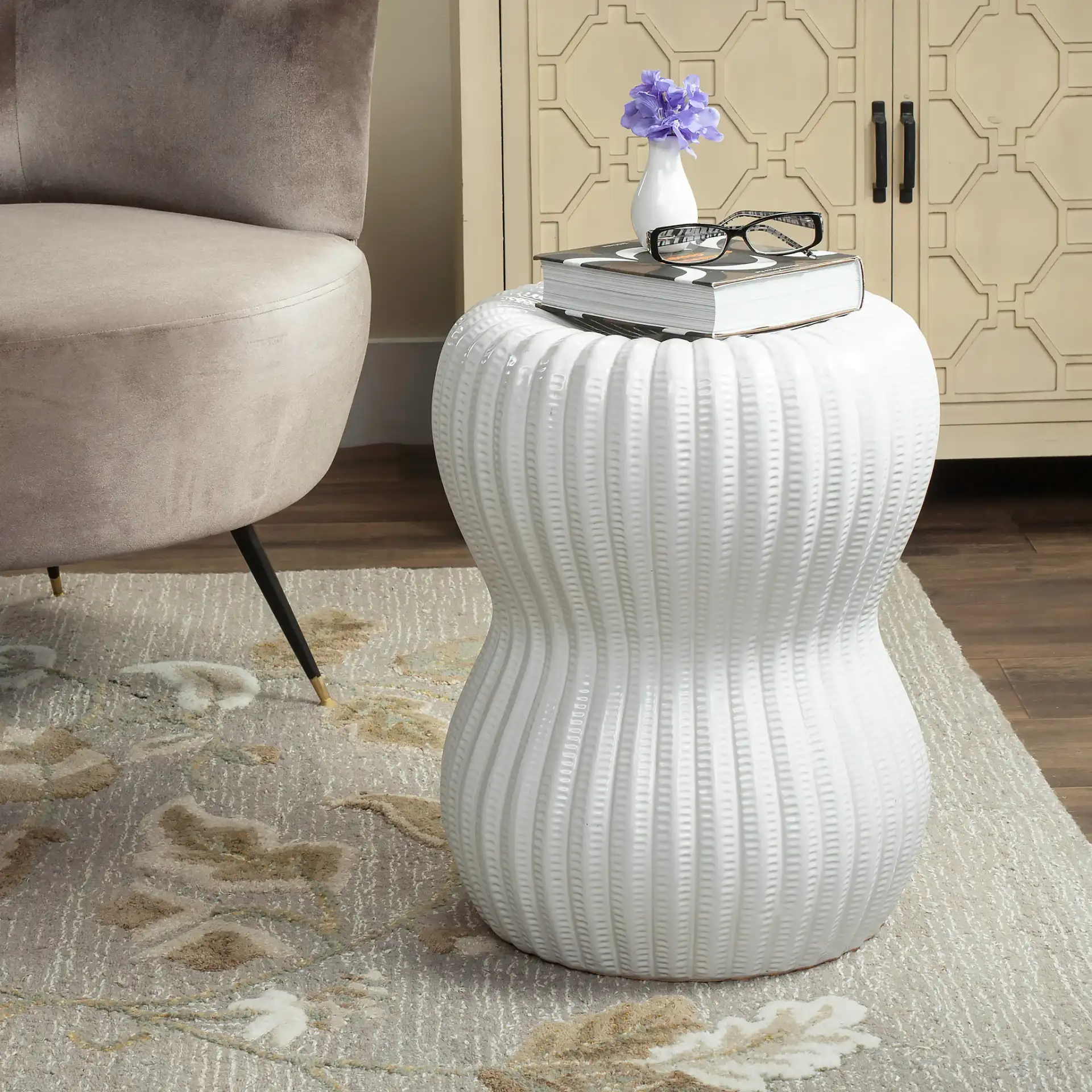 Hour Glass Garden Stool in White in a styled room