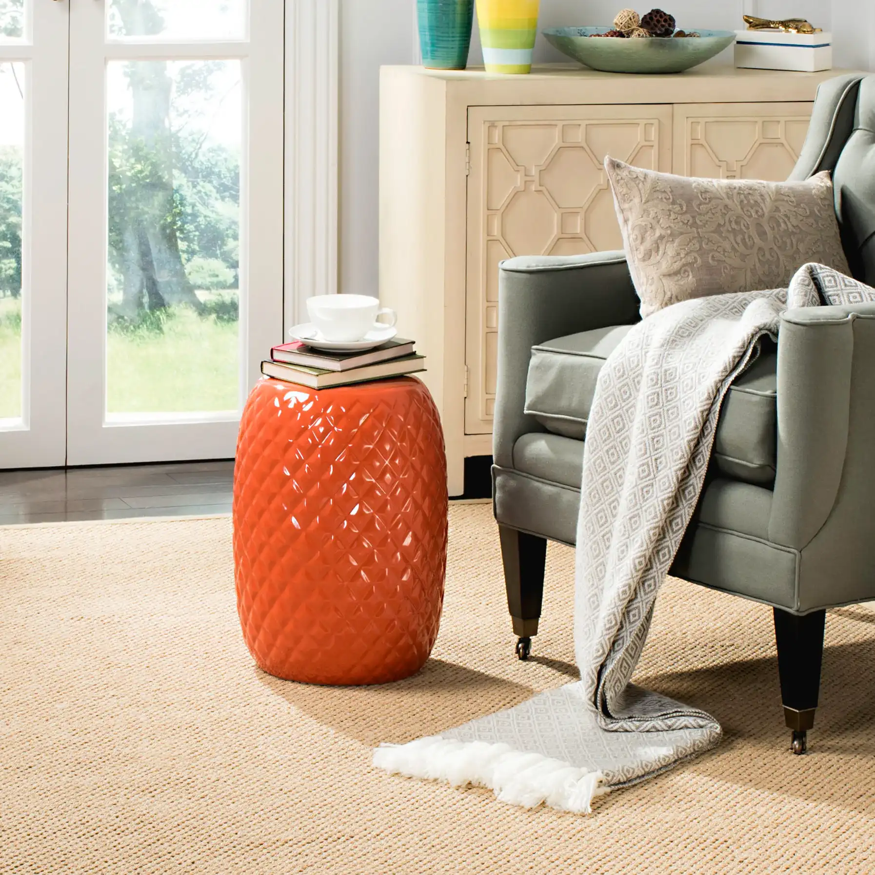 Calla Garden Stool in Orange in a styled room