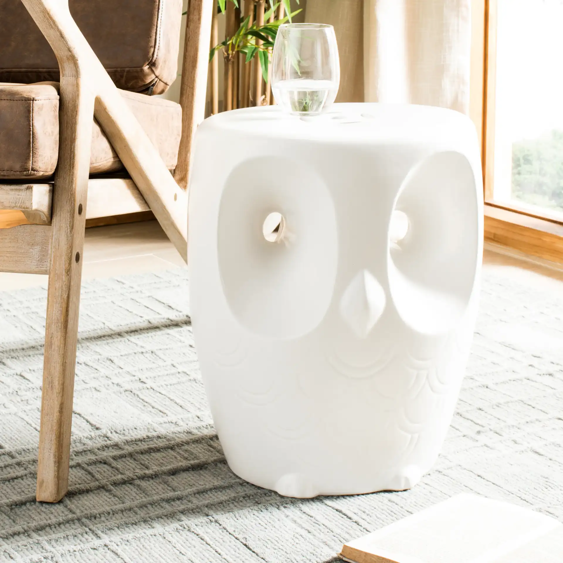 Owl Garden Stool in White in a styled room