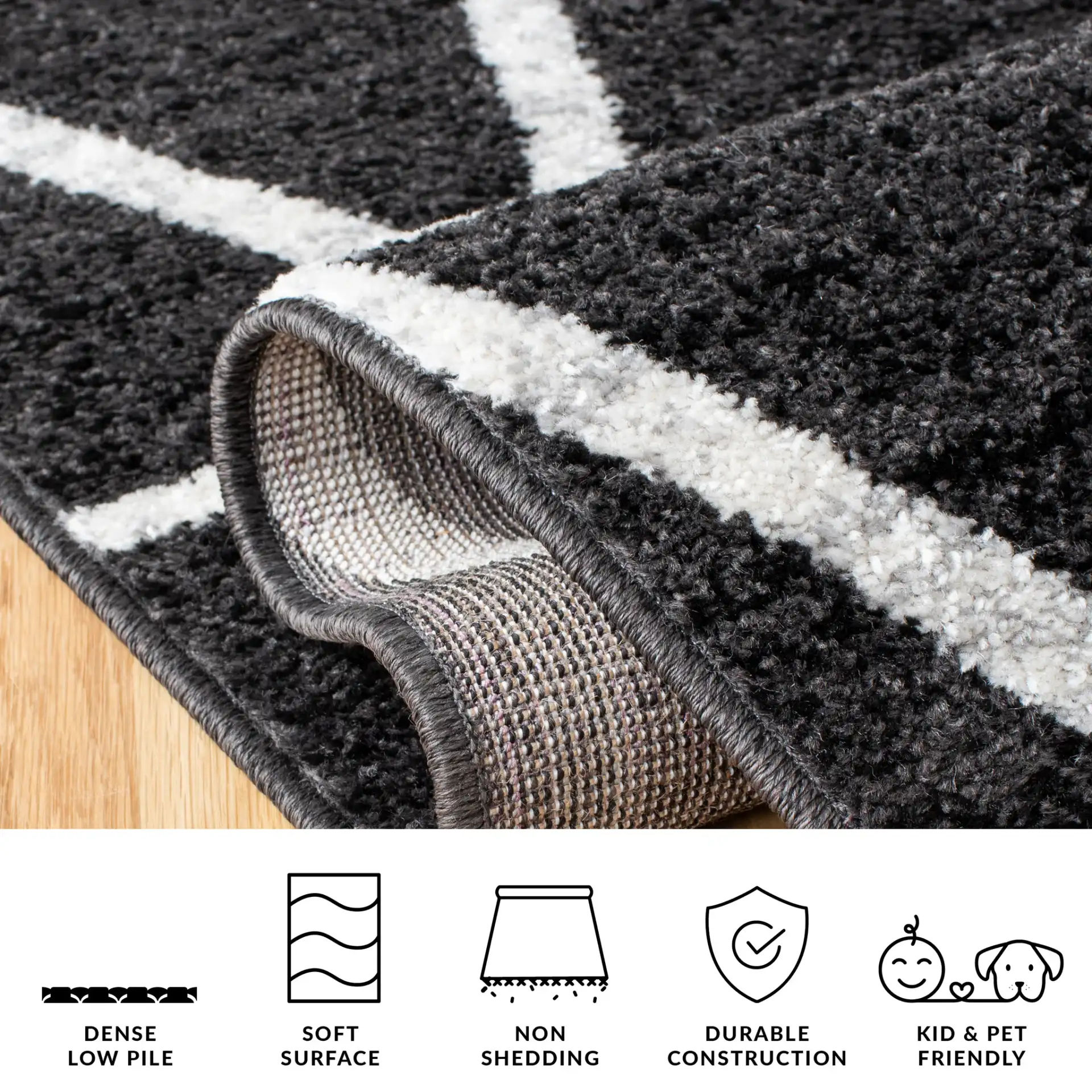 Adirondack Triangle Grid Rug in Black / Ivory in a styled room