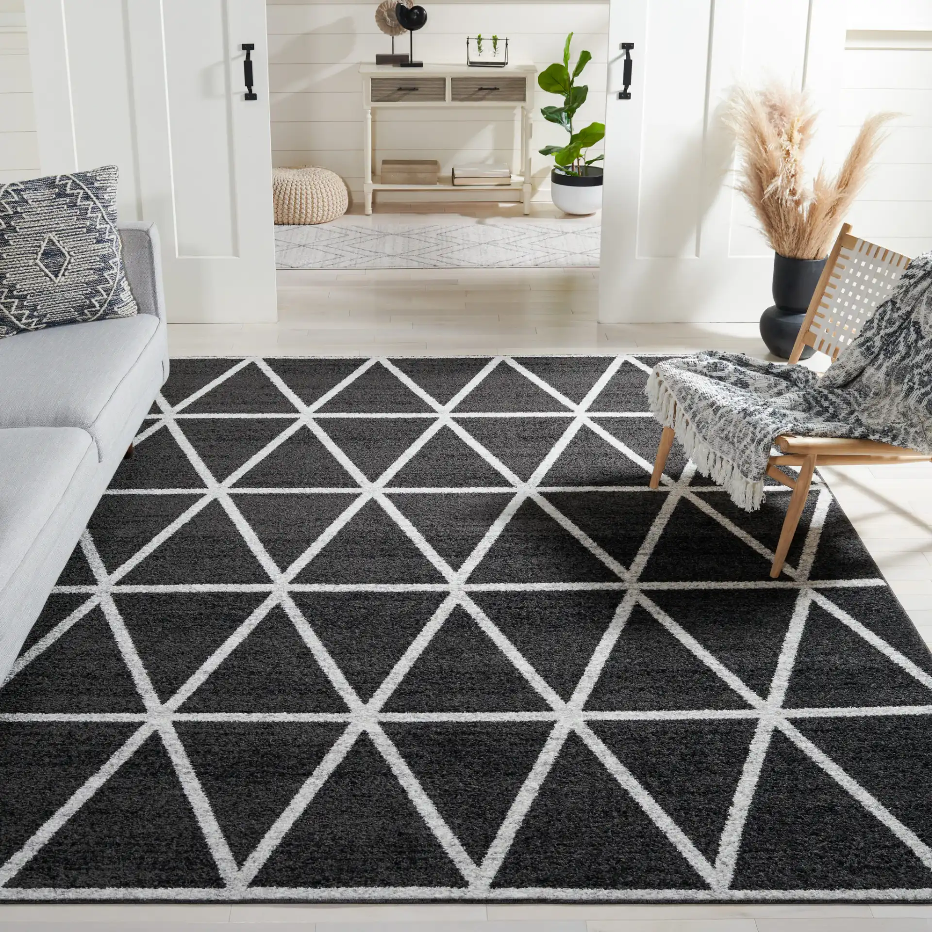 Adirondack Triangle Grid Rug in Black / Ivory in a styled room