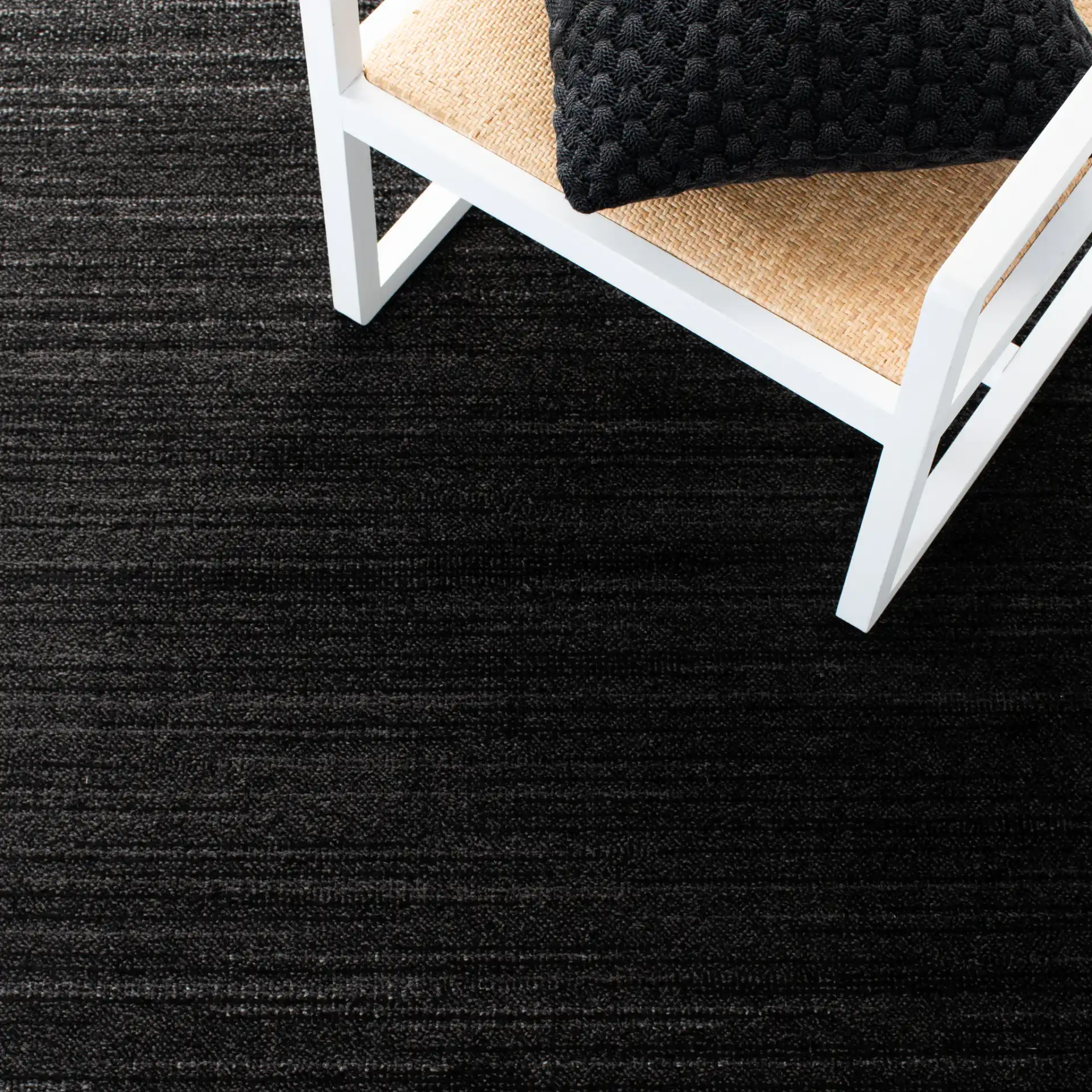 Adirondack Linear Striated Rug in Black / Ivory in a styled room
