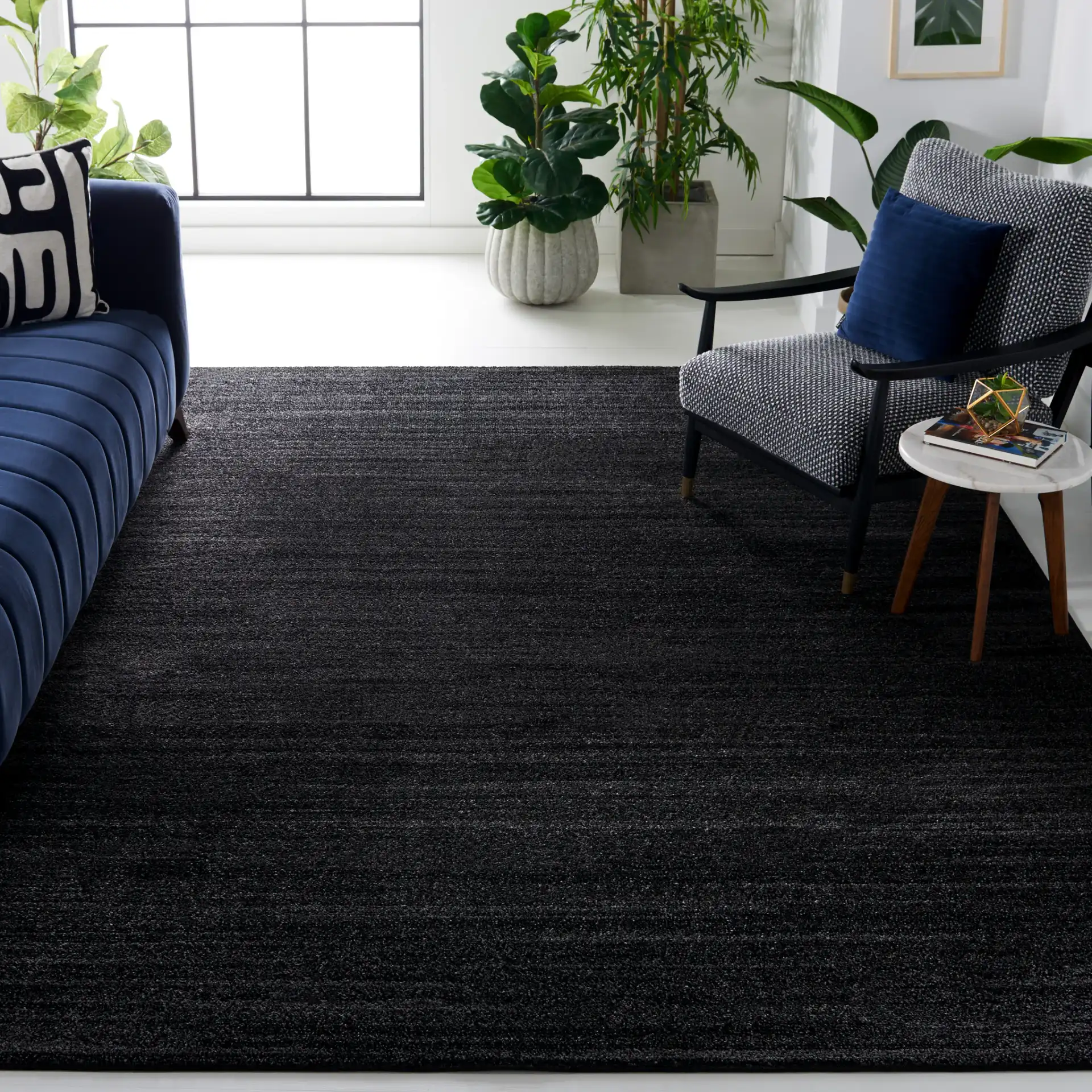 Adirondack Linear Striated Rug in Black / Ivory in a styled room