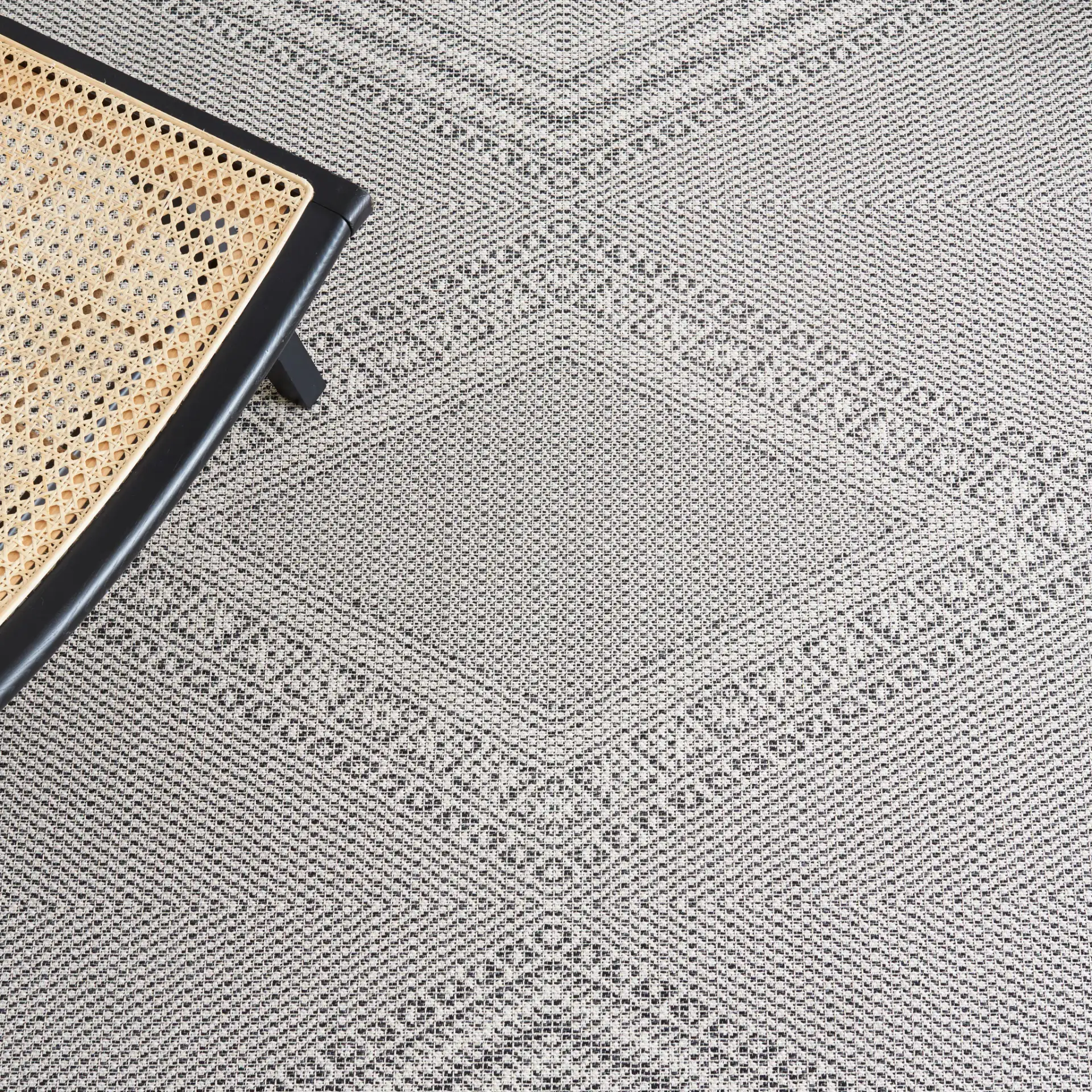 Augustine Concentric Diamond Rug in Ivory / Black in a styled room