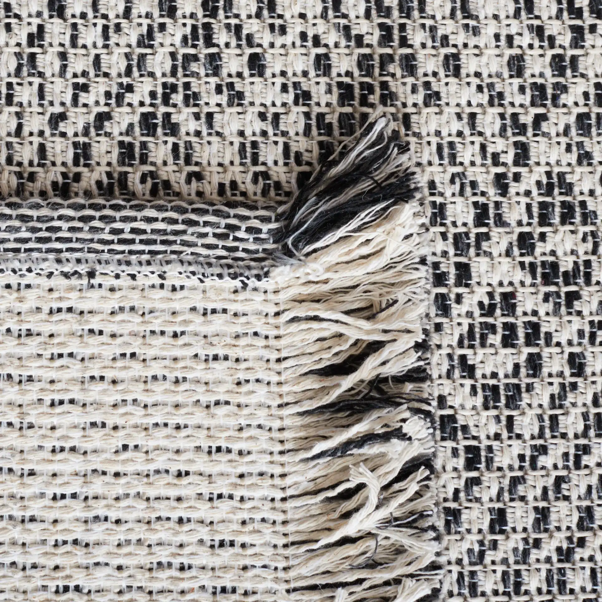 Augustine Concentric Diamond Rug in Ivory / Black in a styled room