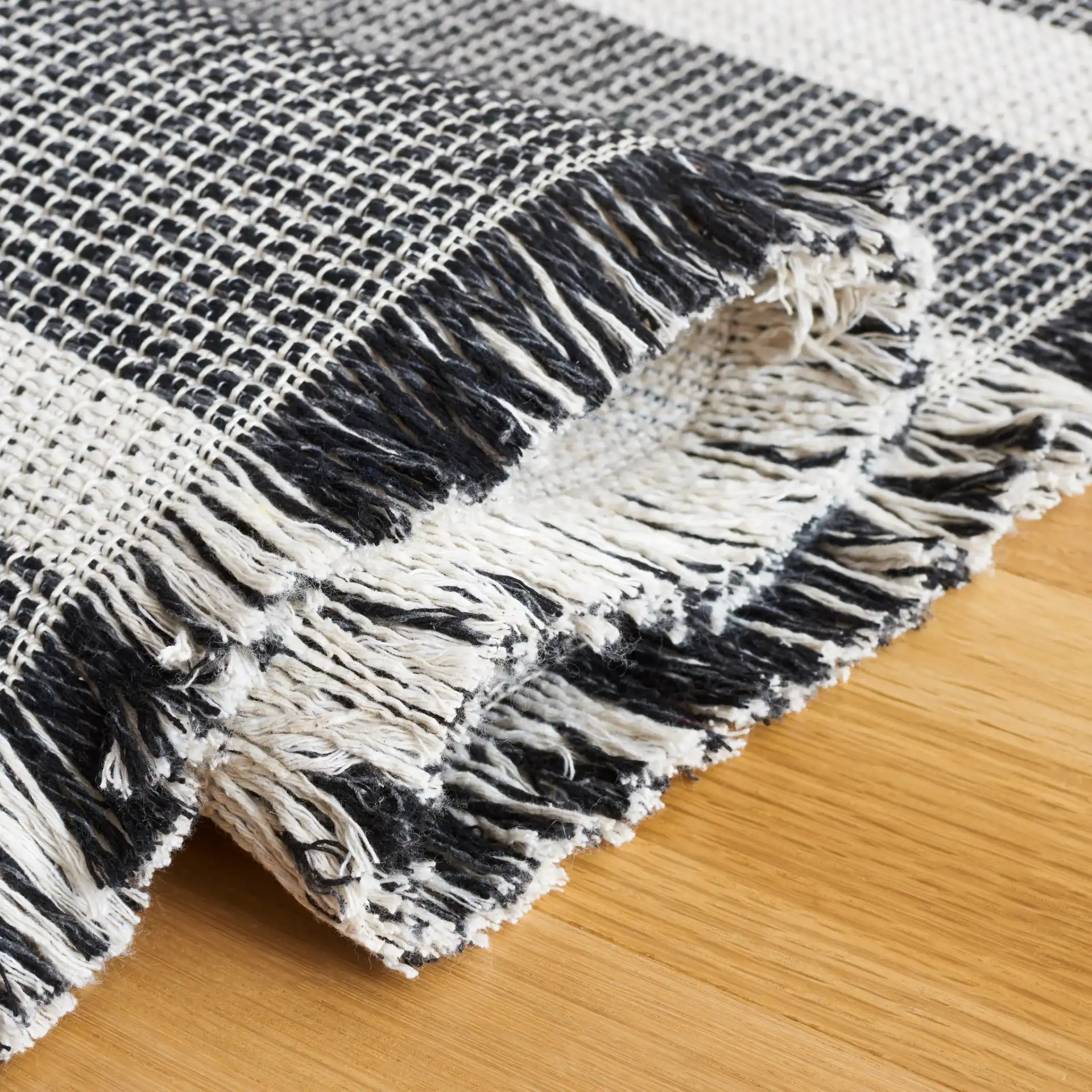 Augustine Striped Rug in Ivory / Black in a styled room